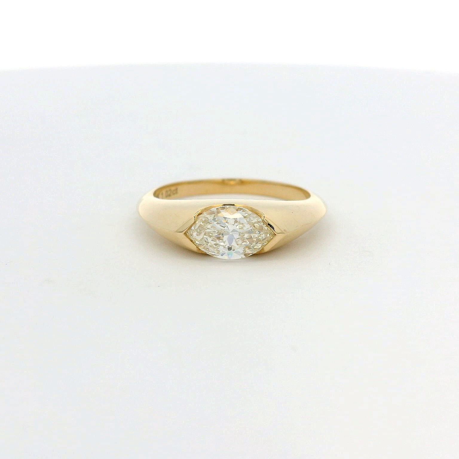 14KT yellow gold east-west half bezel set 1.02ct marquise diamond ring
