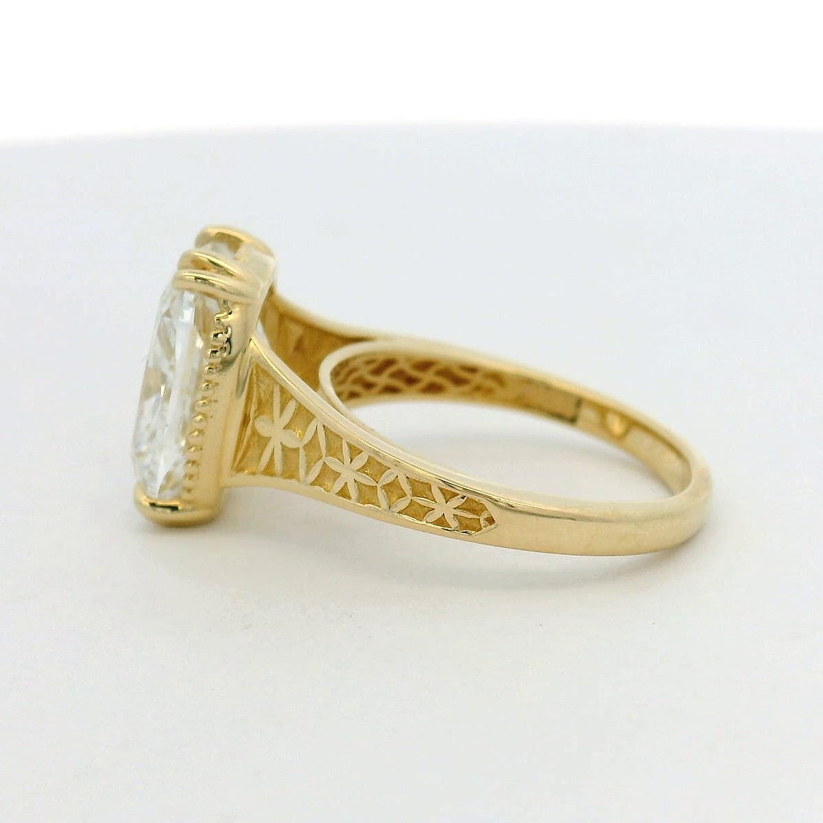 14KT yellow gold double prong detailed band 5.04ct elongated cushion LG diamond engagement ring