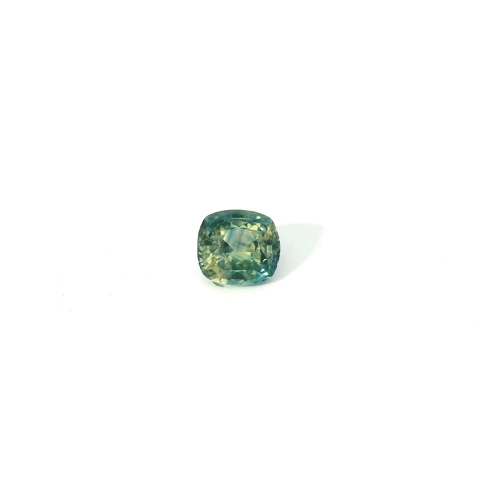 green cushion cut sapphire