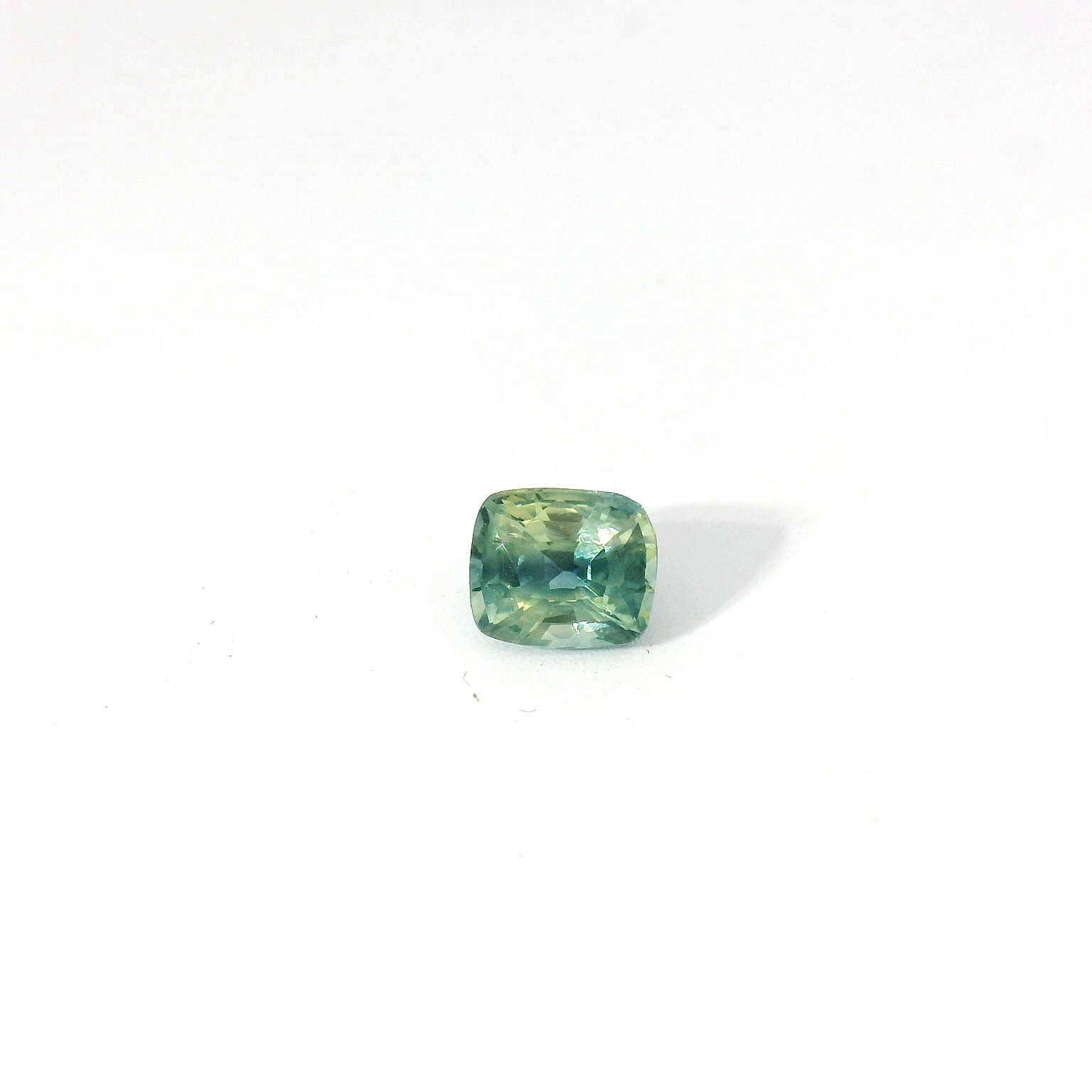Green cushion sapphire