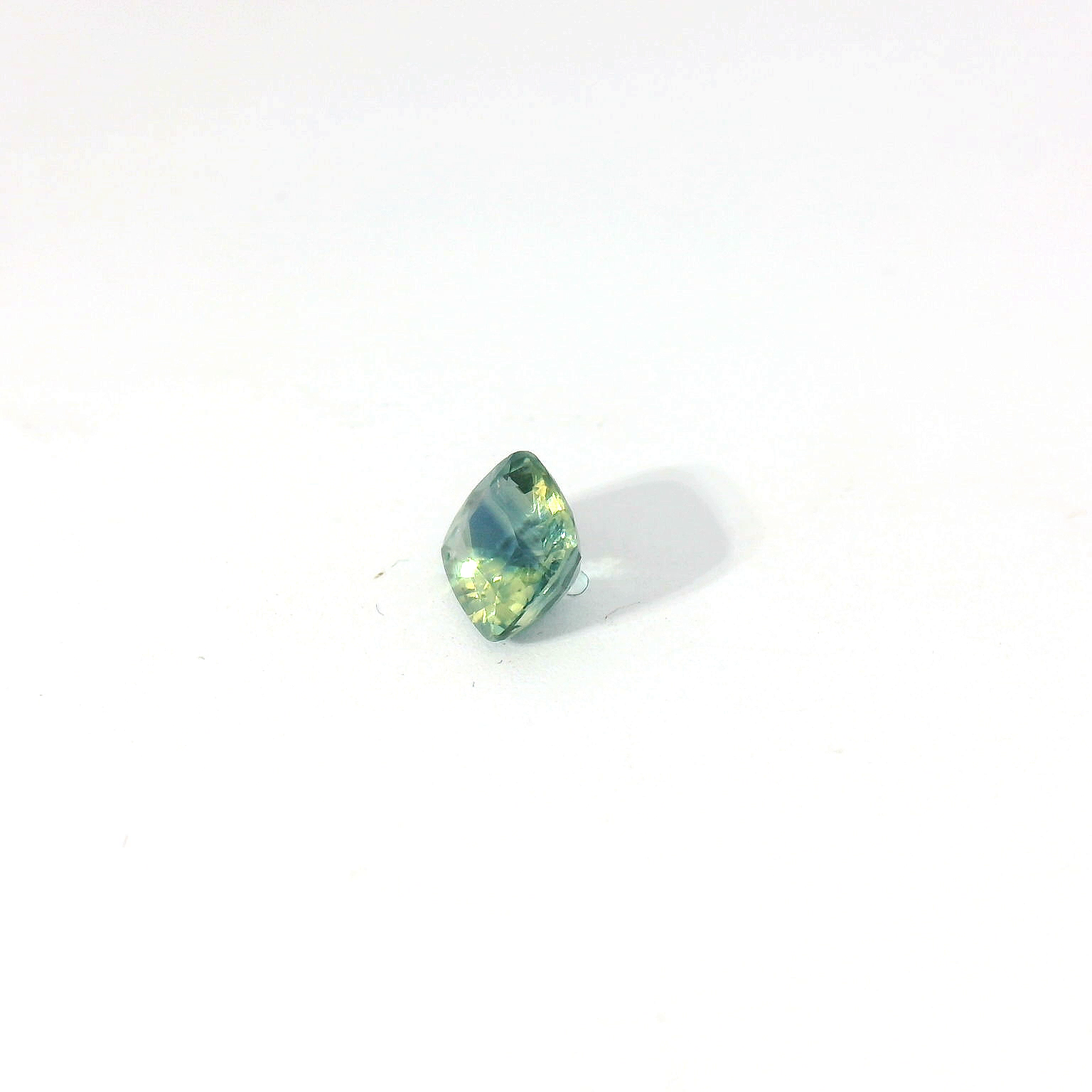 Green cushion sapphire