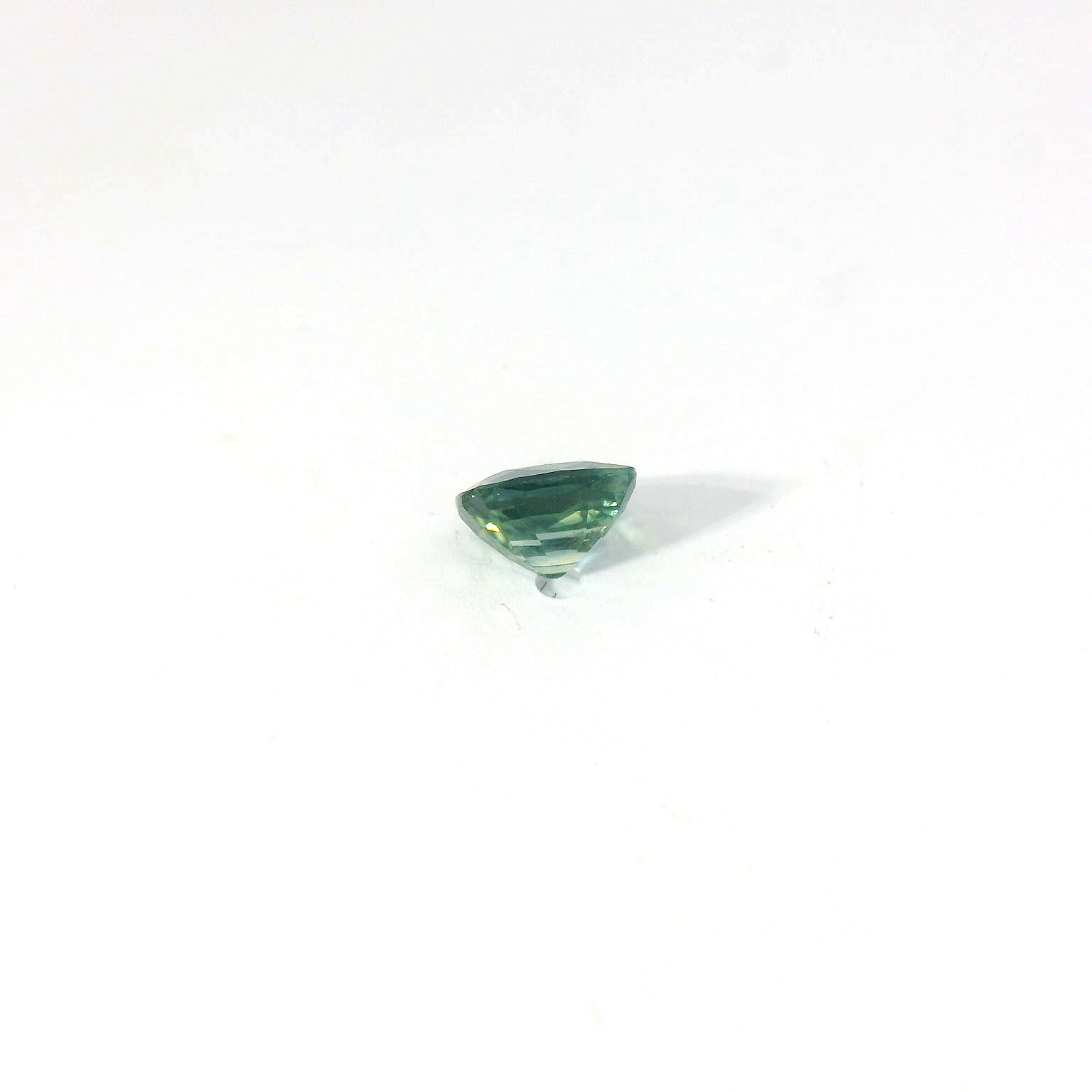 Green cushion sapphire
