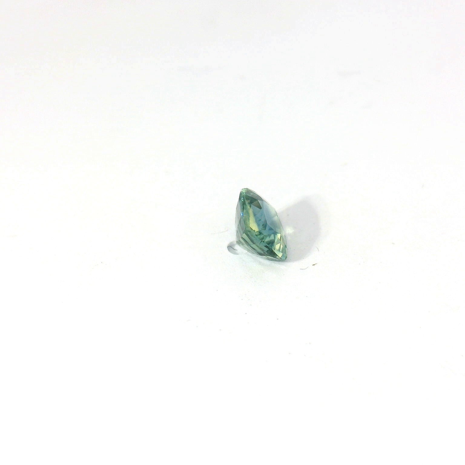 Green cushion sapphire