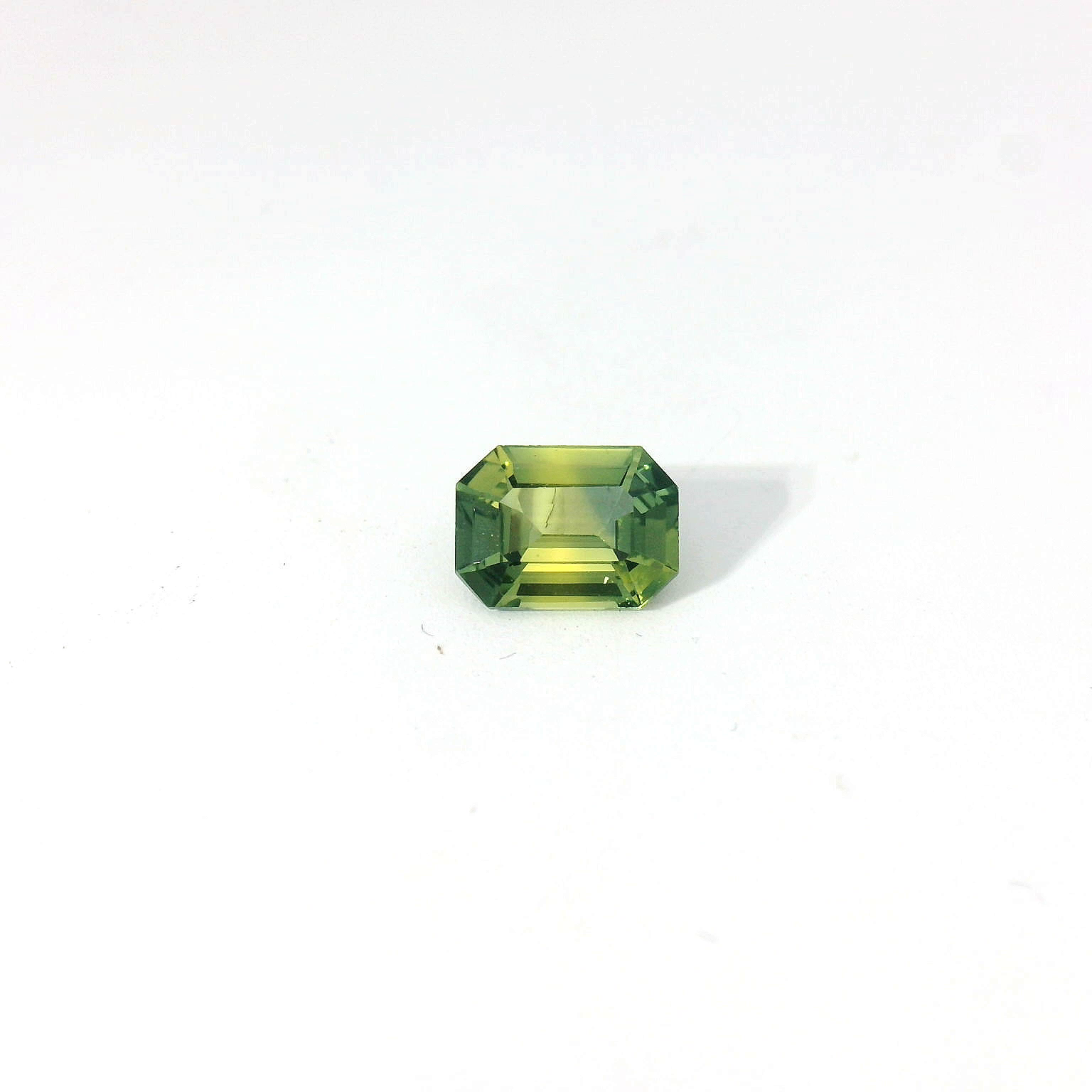 green emerald cut sapphire