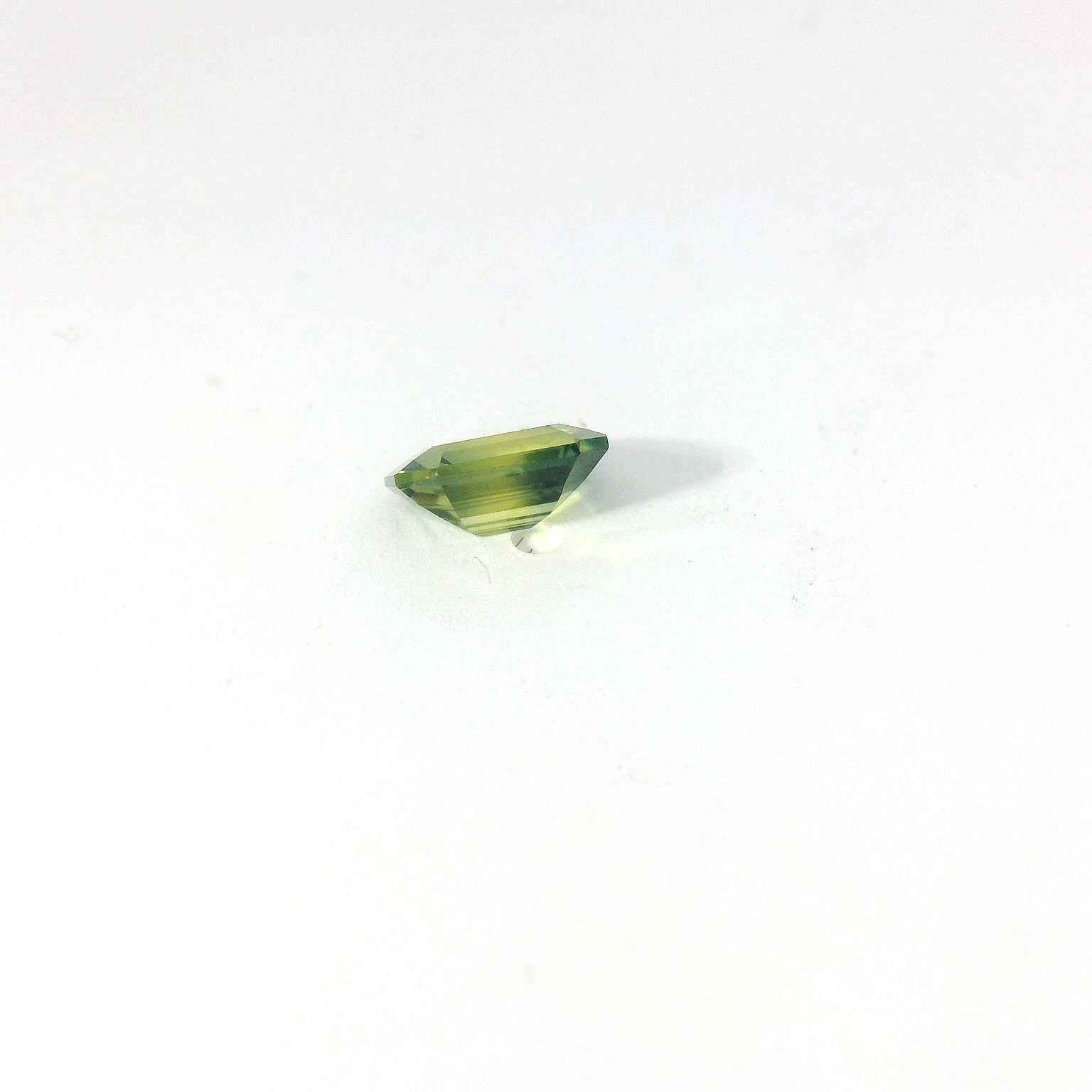 green emerald cut sapphire