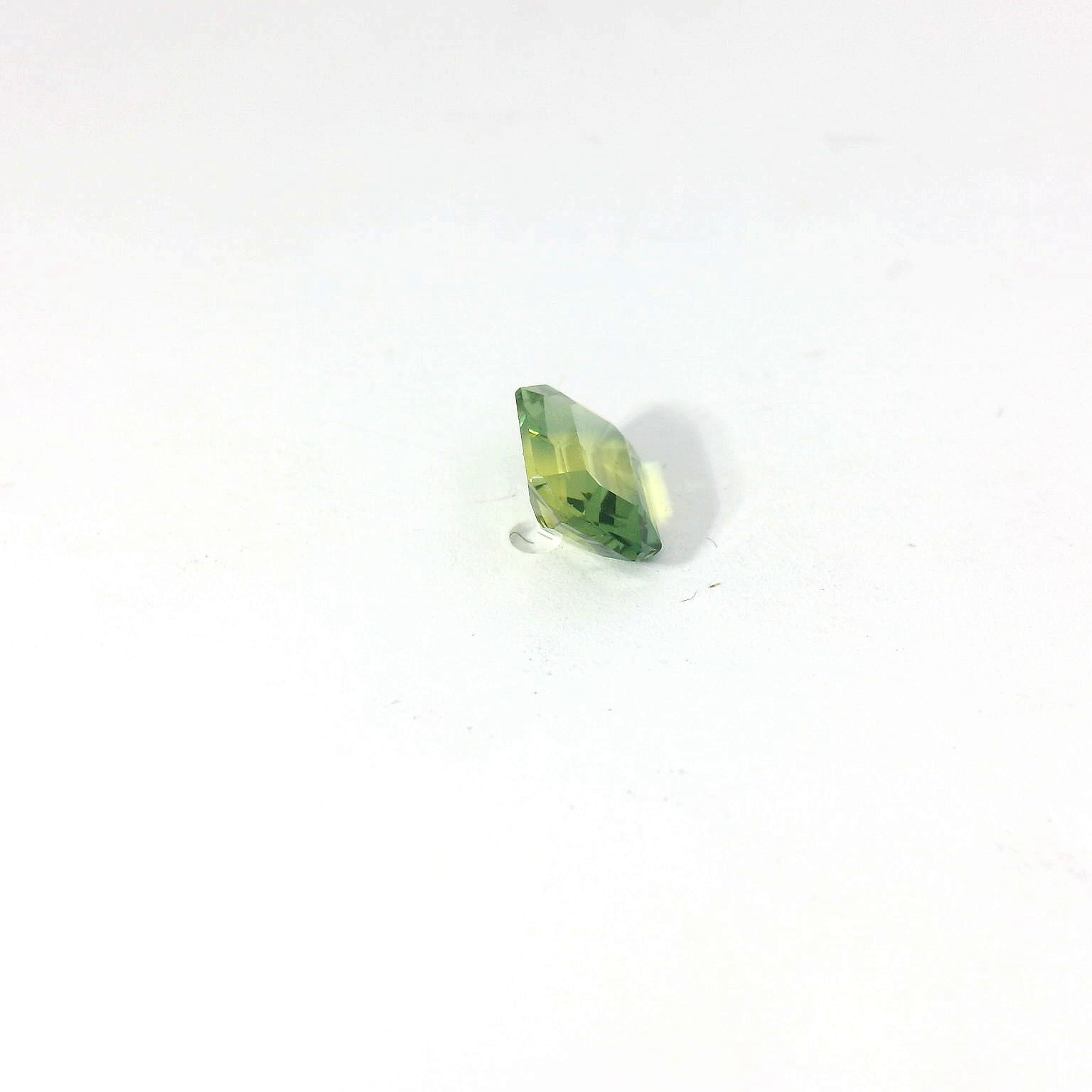 green emerald cut sapphire