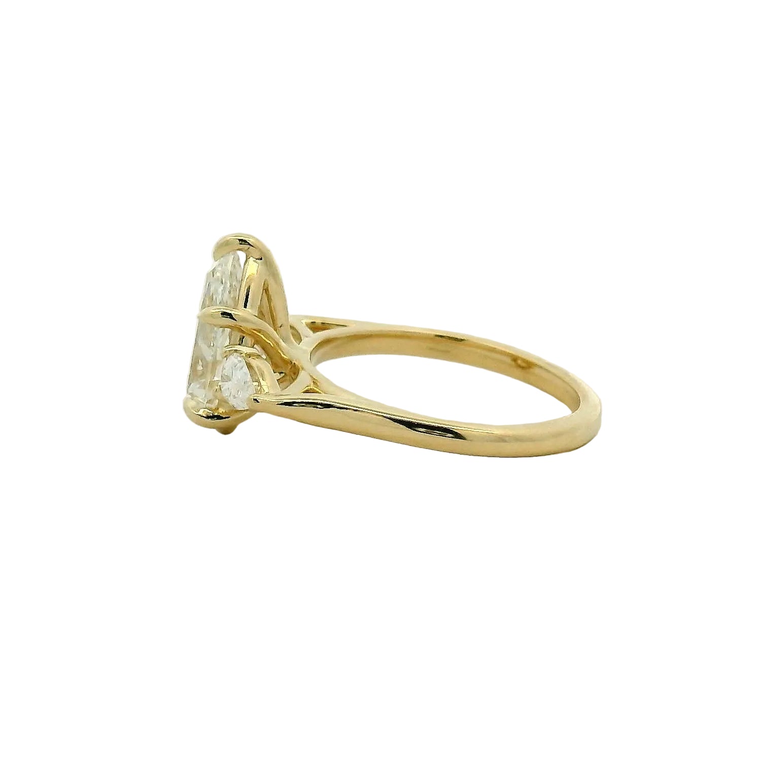 Pear Cut Three-Stone Diamond Engagement Ring in Yellow Gold