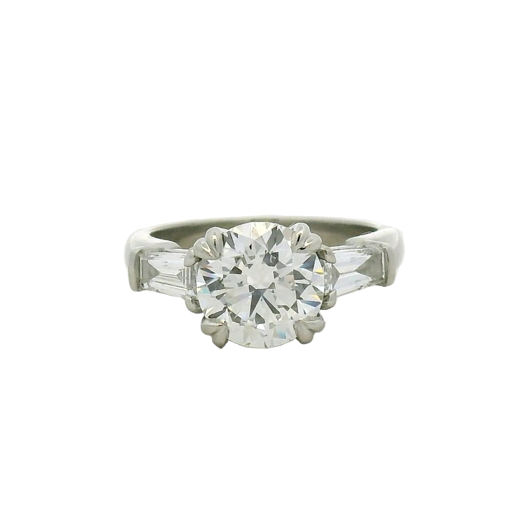 Round Brilliant and Baguette Diamond Engagement Ring in Platinum
