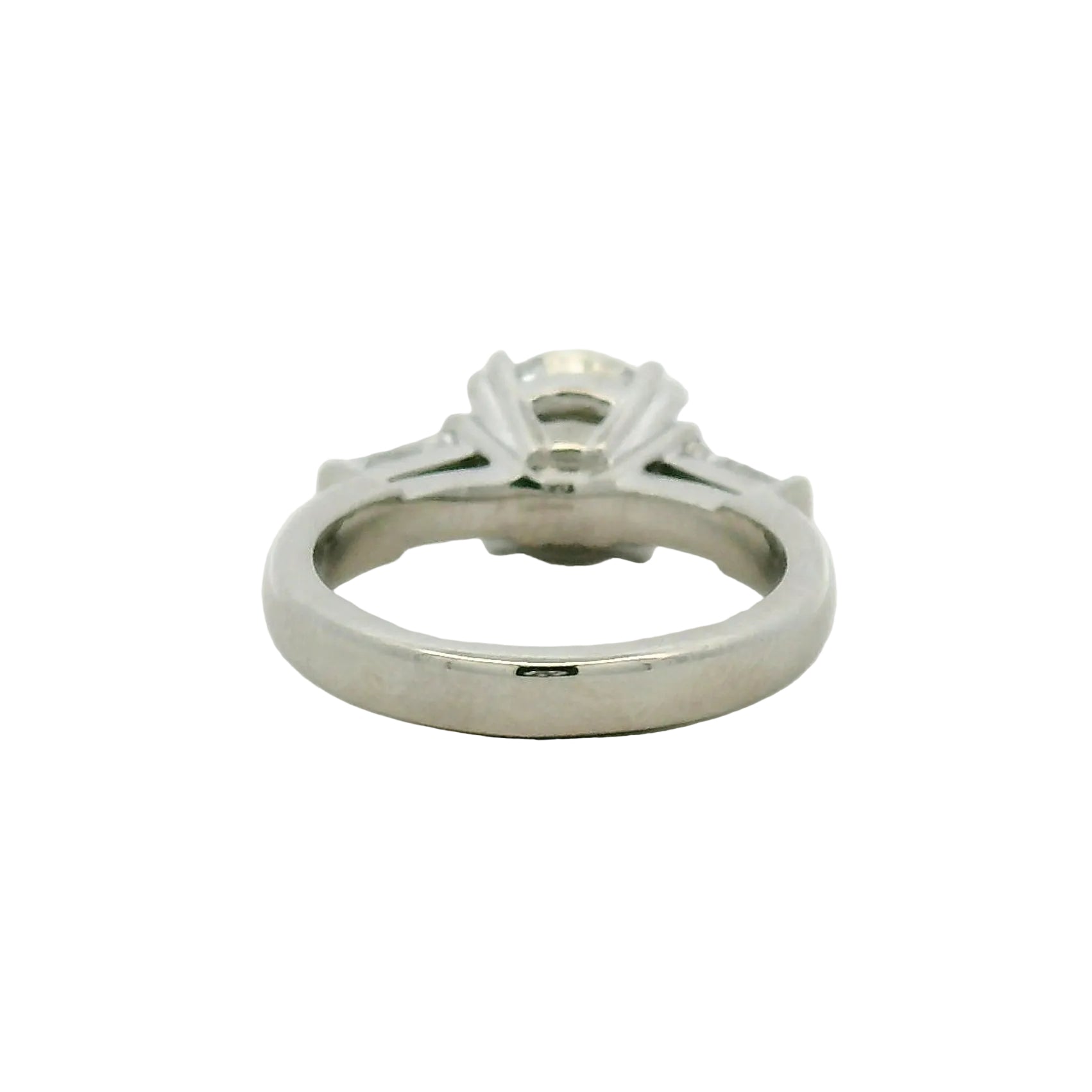 Round Brilliant and Baguette Diamond Engagement Ring in Platinum