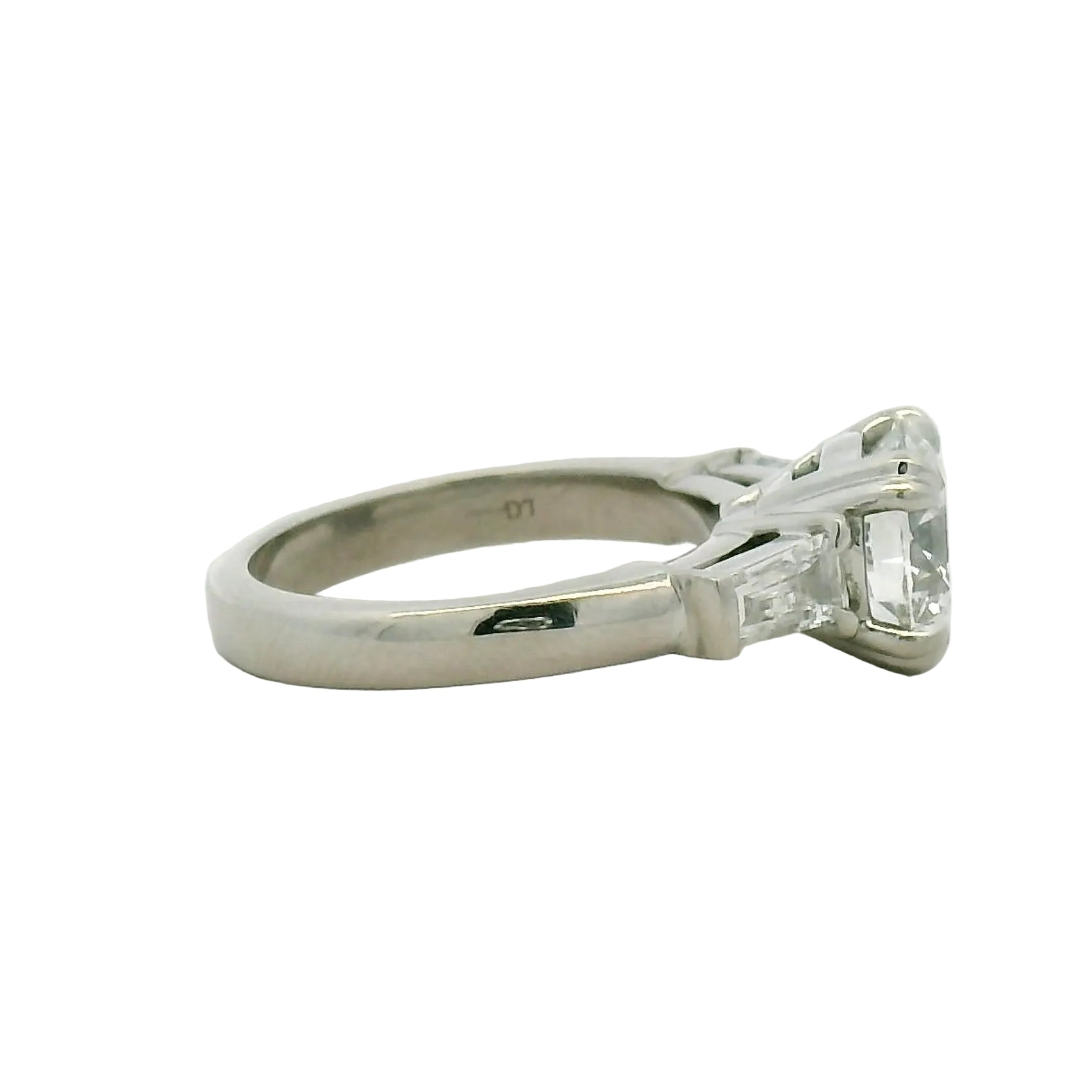 Round Brilliant and Baguette Diamond Engagement Ring in Platinum
