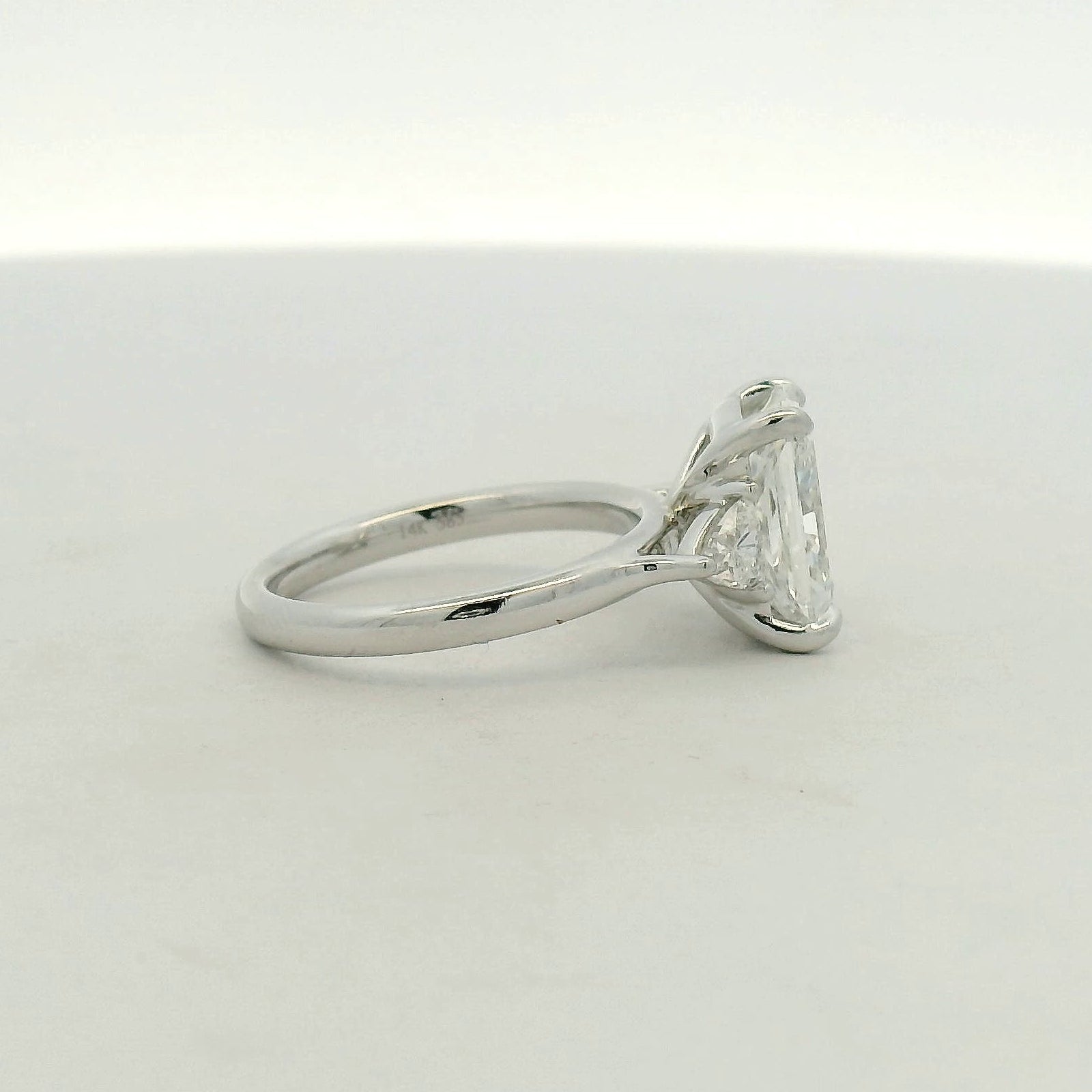 Radiant Cut Three-Stone Diamond Ring in White Gold