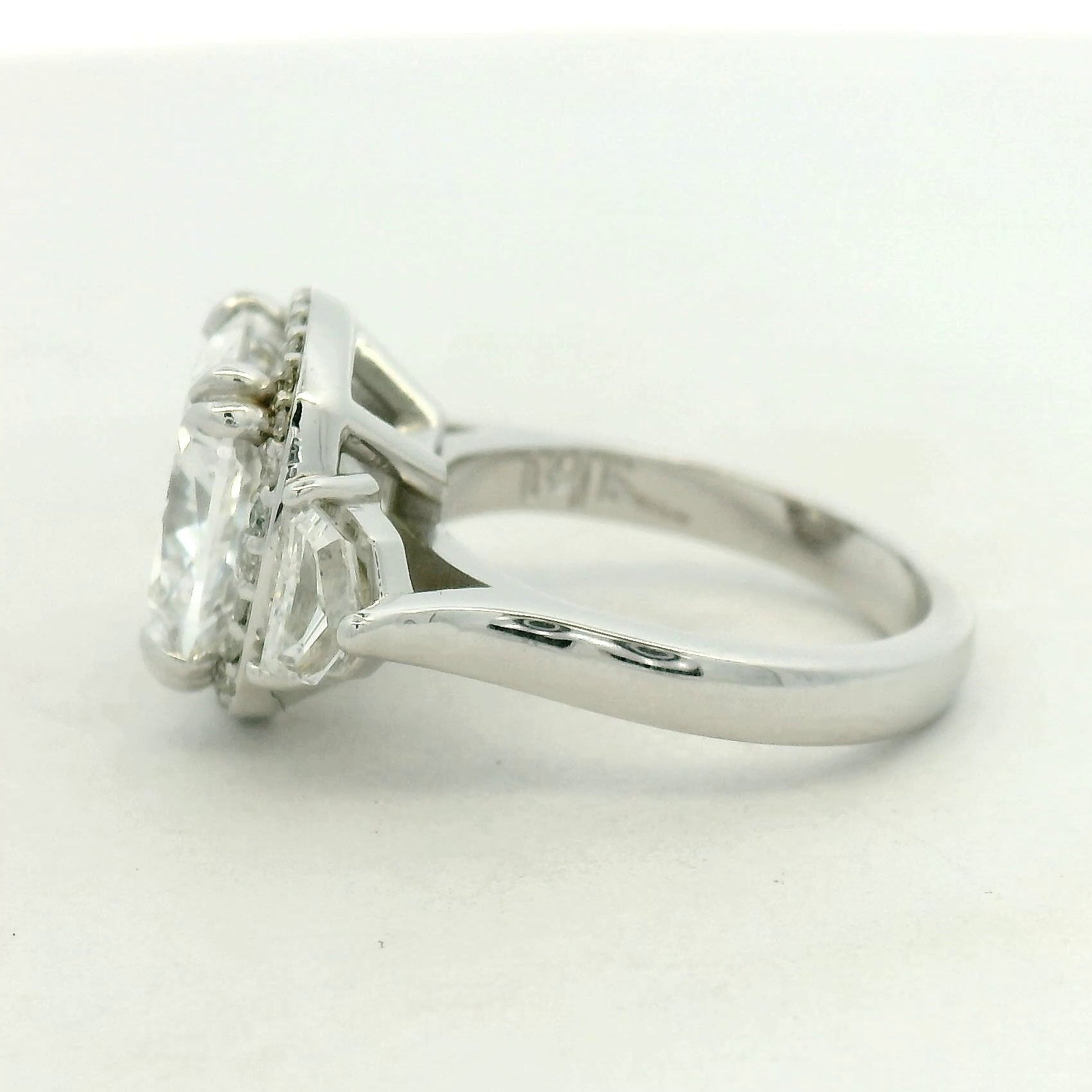 THREE STONE RING WITH HALO