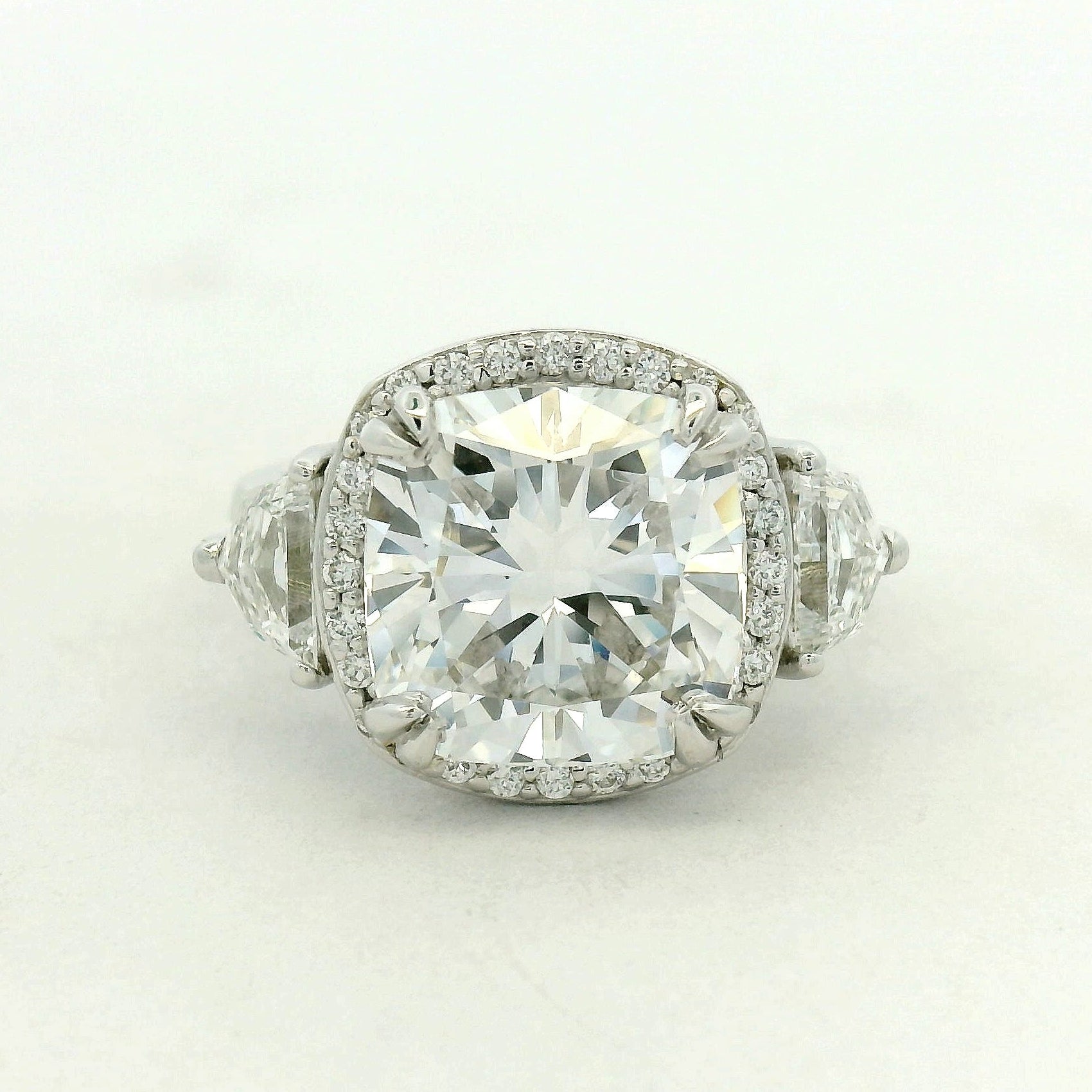 THREE STONE RING WITH HALO