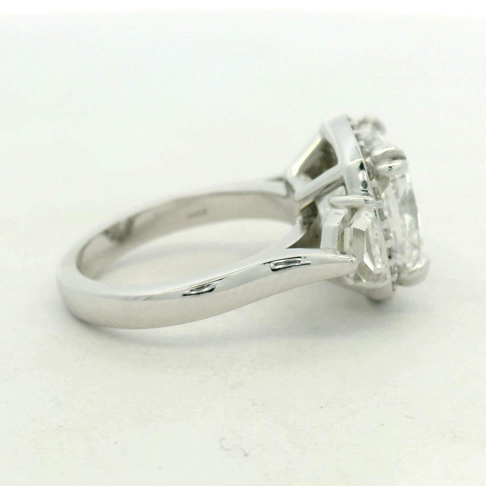 THREE STONE RING WITH HALO