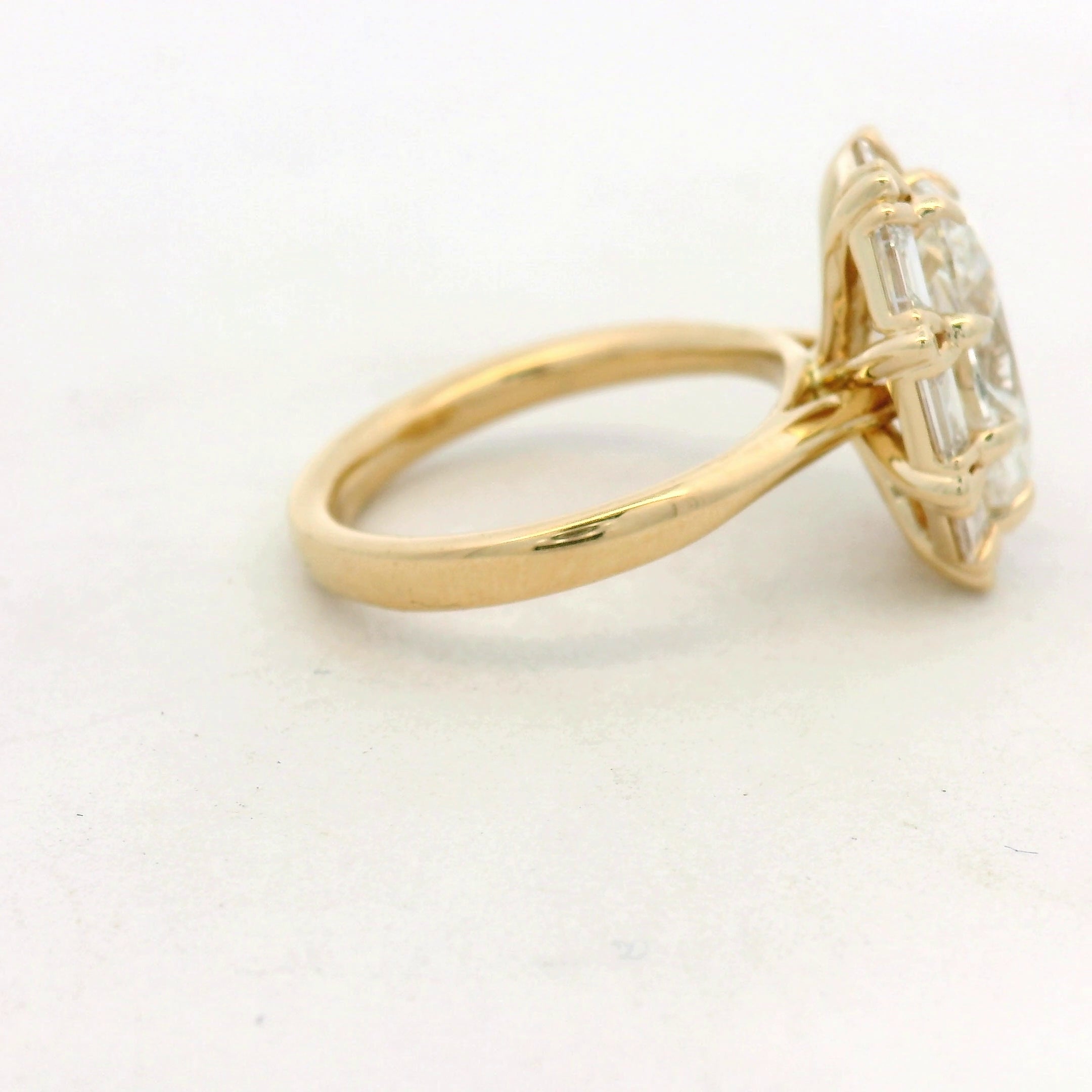 Oval Diamond Baguette Halo Ring in Yellow Gold