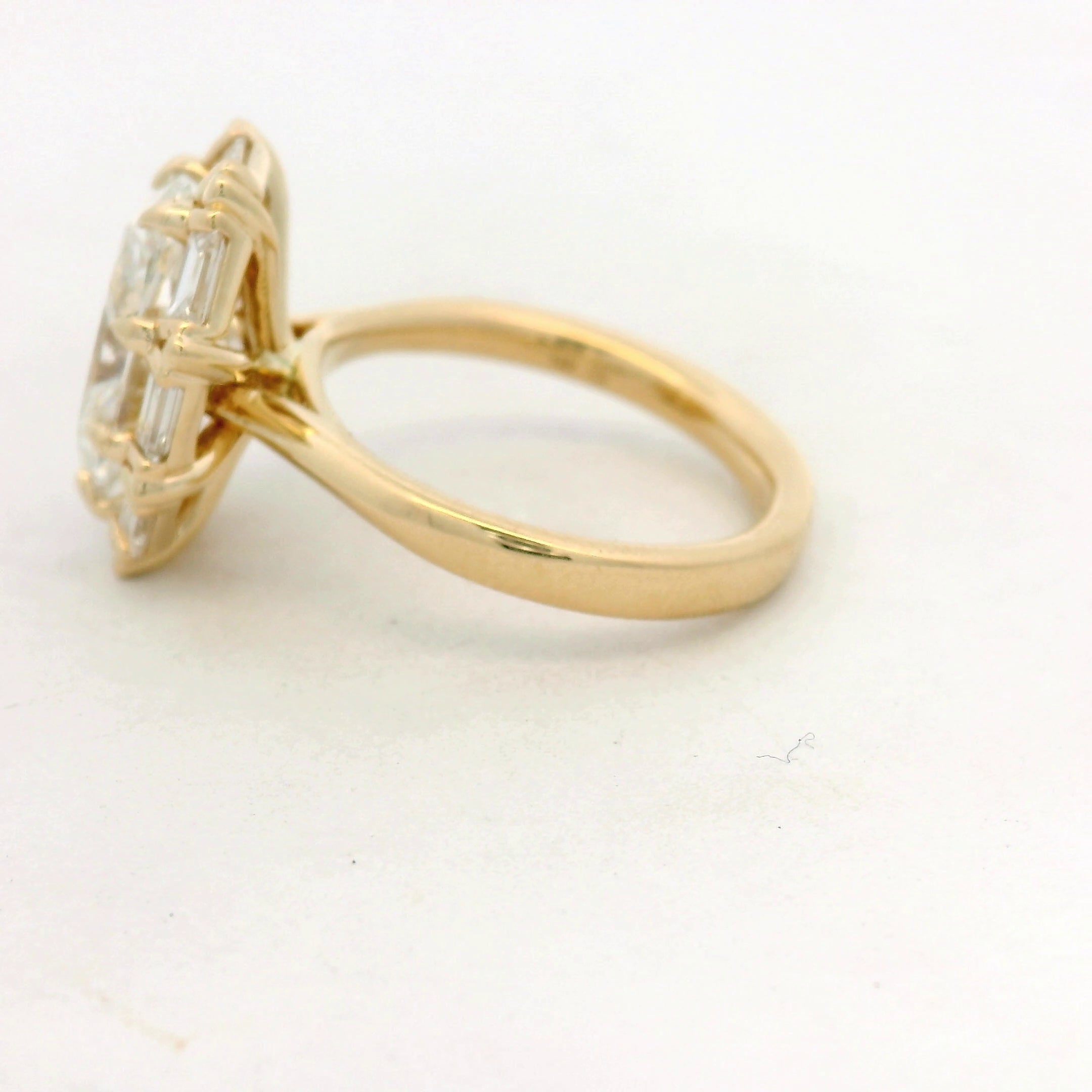 Oval Diamond Baguette Halo Ring in Yellow Gold