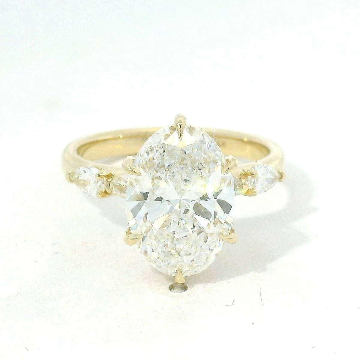 Yellow Gold Oval Diamond Engagement Ring with Side Stones