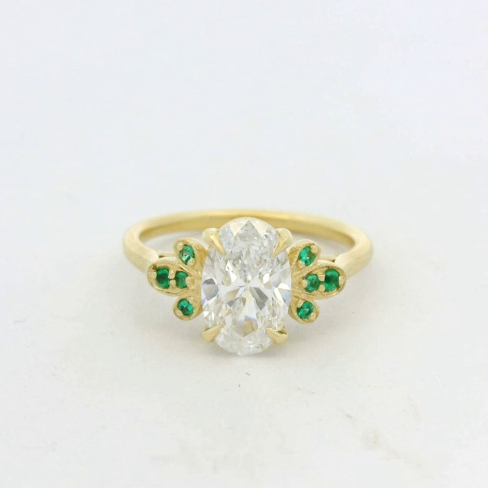 18KT Yellow Gold Oval Diamond Emerald Side Stone engagement ring