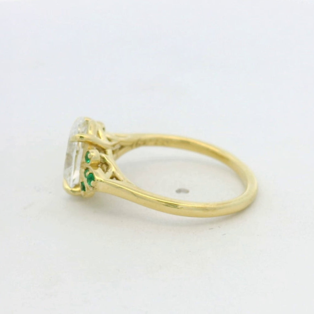 18KT Yellow Gold Oval Diamond Emerald Side Stone engagement ring