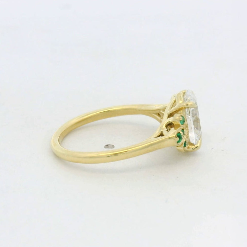 18KT Yellow Gold Oval Diamond Emerald Side Stone engagement ring