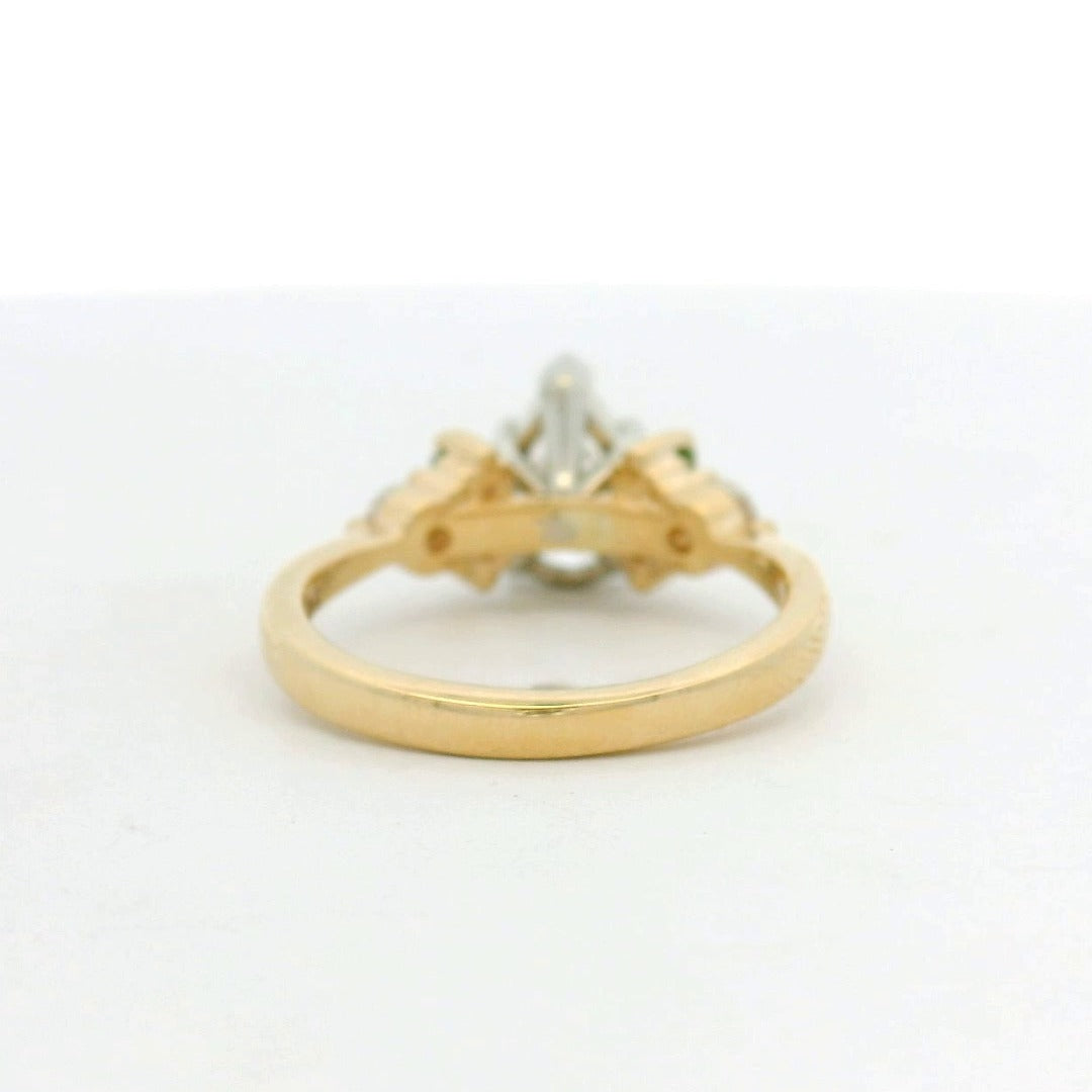 14KT two tone pear diamond with green sapphire and diamond side stones engagement ring
