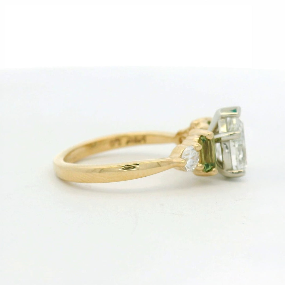14KT two tone pear diamond with green sapphire and diamond side stones engagement ring