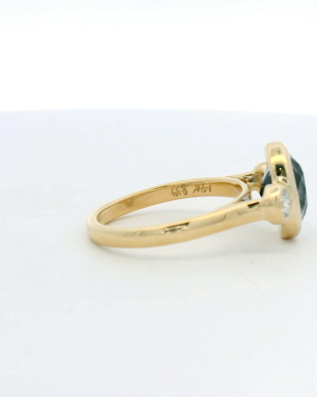14KT yellow gold bezel set three stone sapphire and diamond engagement ring