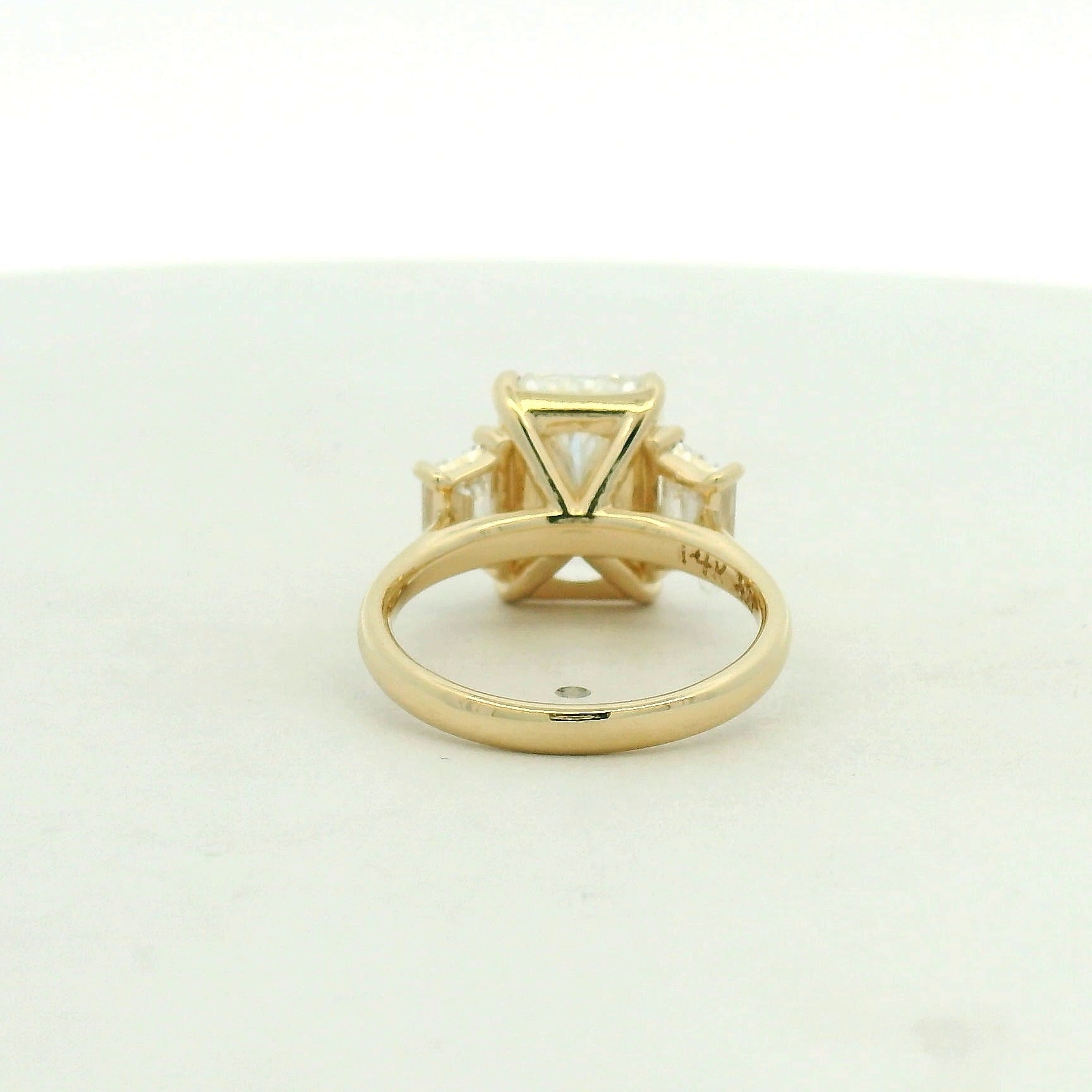 14kt yellow gold three stone ring one radiant & two trapezoid side stones