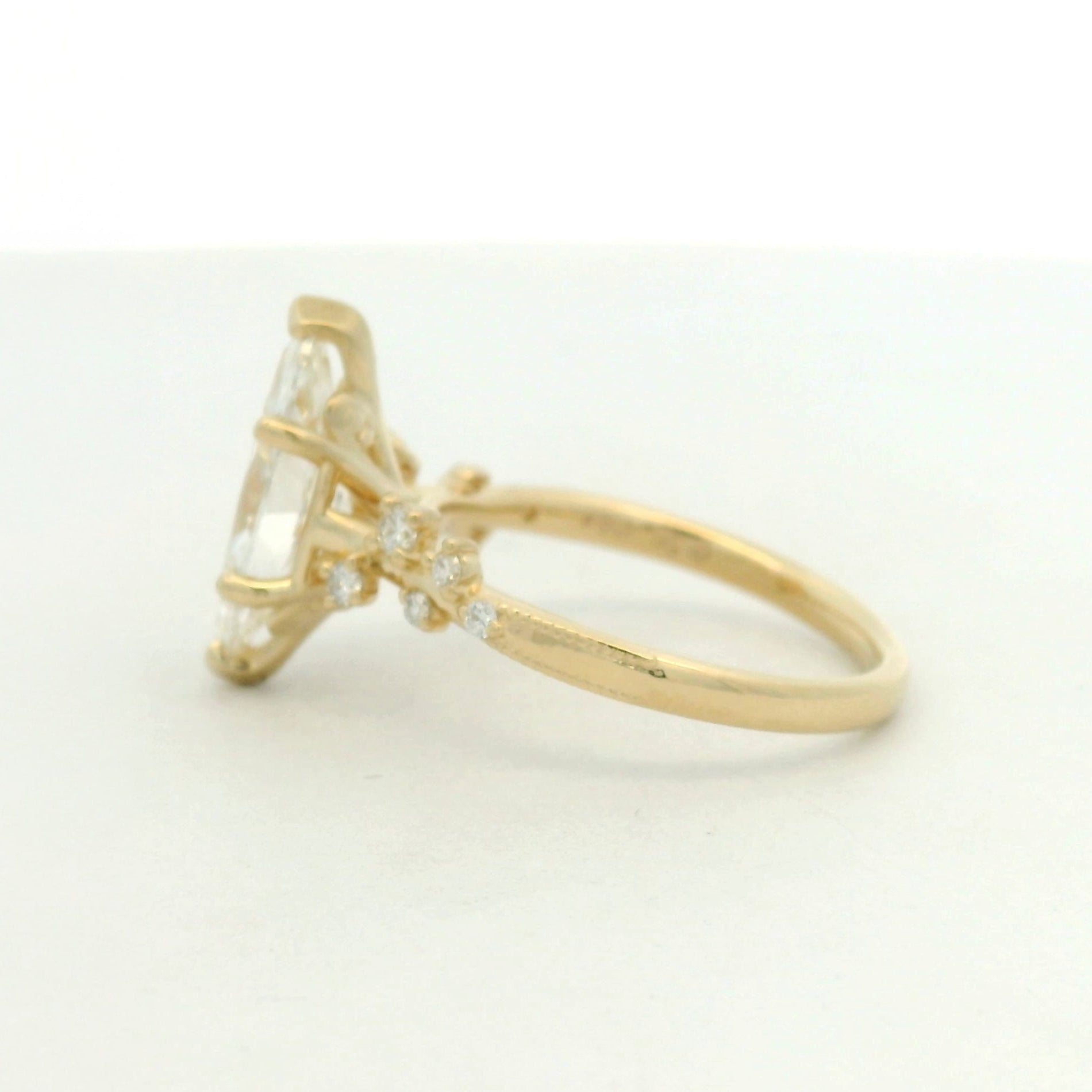 14kt yellow gold ring marquise center stone and scattered side stone