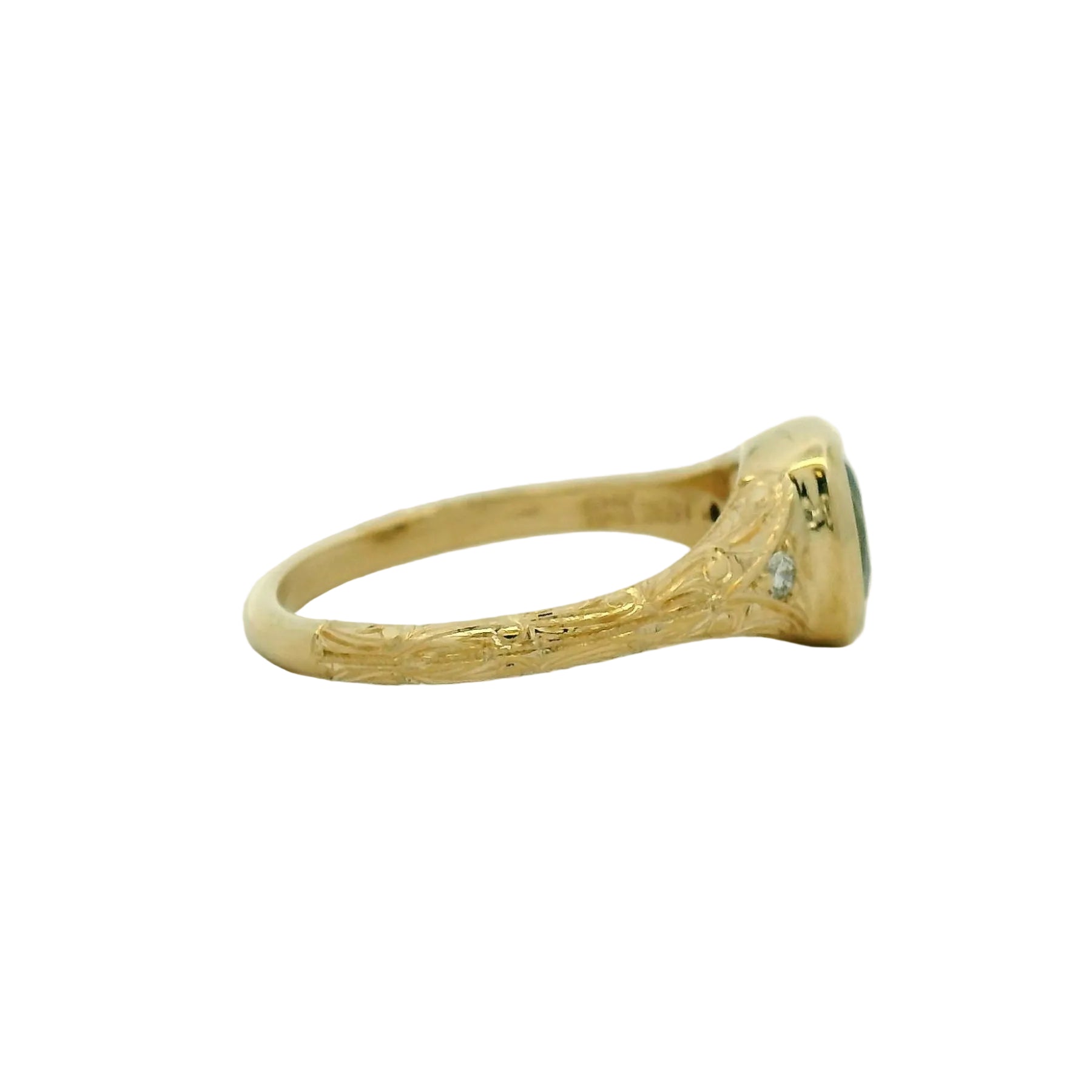 14k yg bezel cushion sapphire ring with small stones and hand engraving