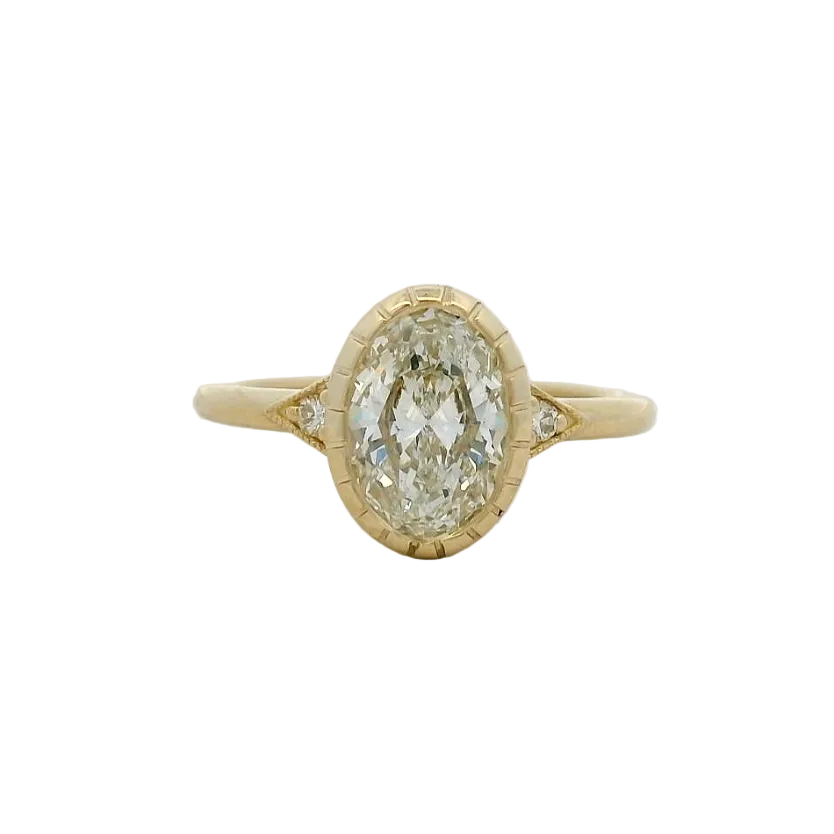 14KT yellow gold oval bezel set side stone engagement ring