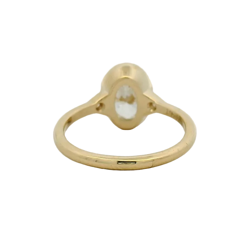 14KT yellow gold oval bezel set side stone engagement ring