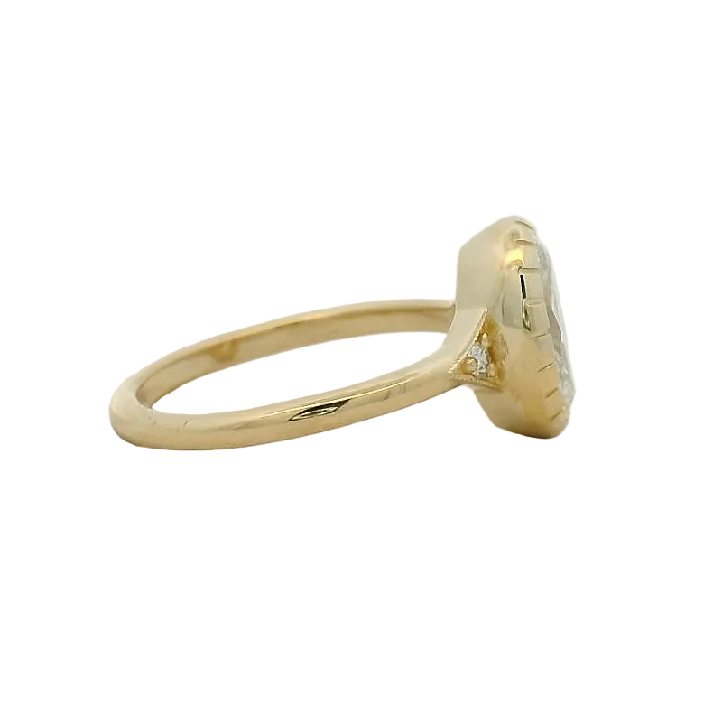 14KT yellow gold oval bezel set side stone engagement ring