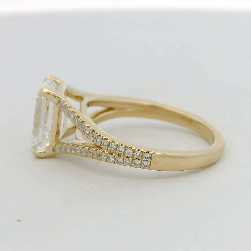 14KT yellow gold split shank Emerald LG Dia Engagement Ring