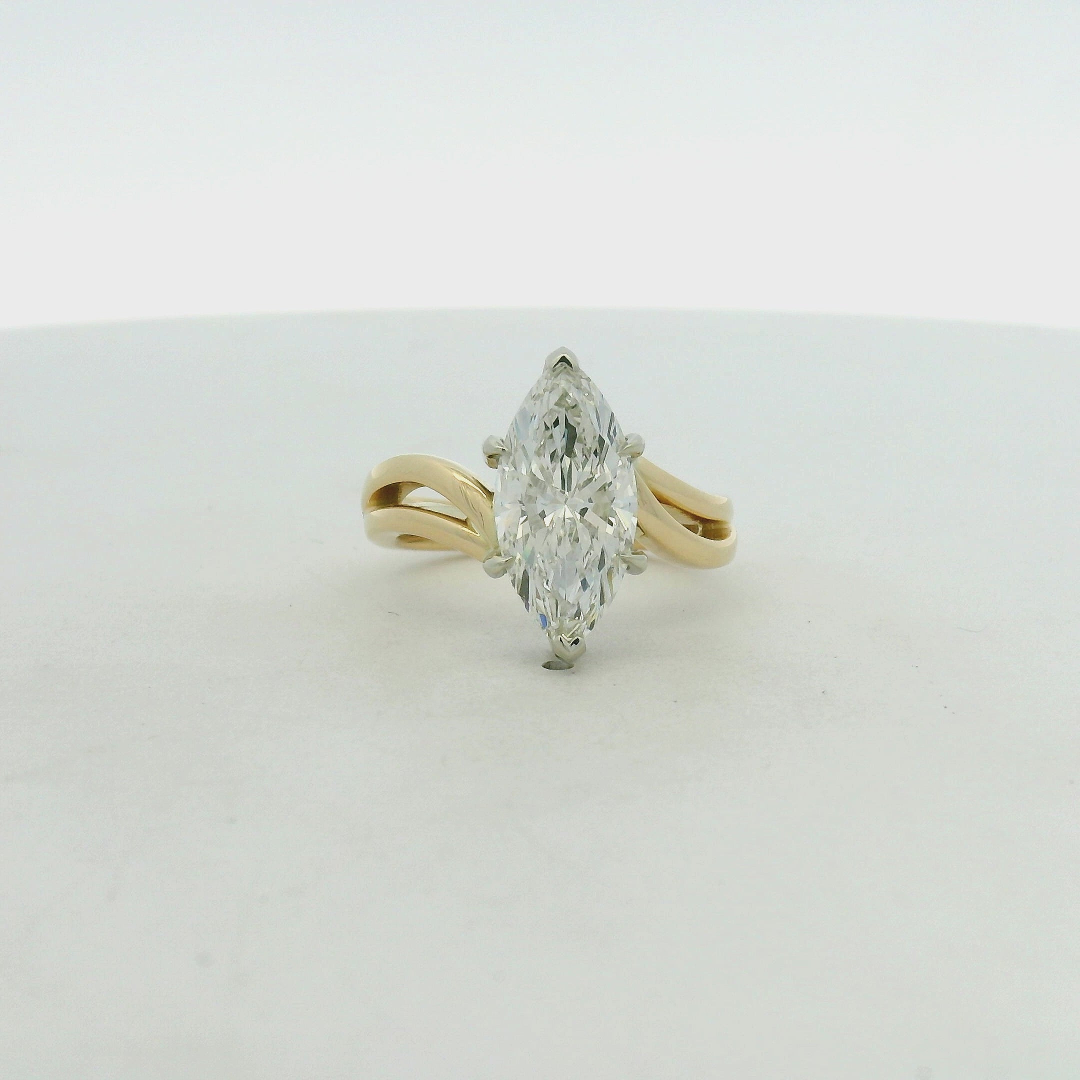 Marquise Diamond Split Shank Solitaire Ring in Yellow Gold