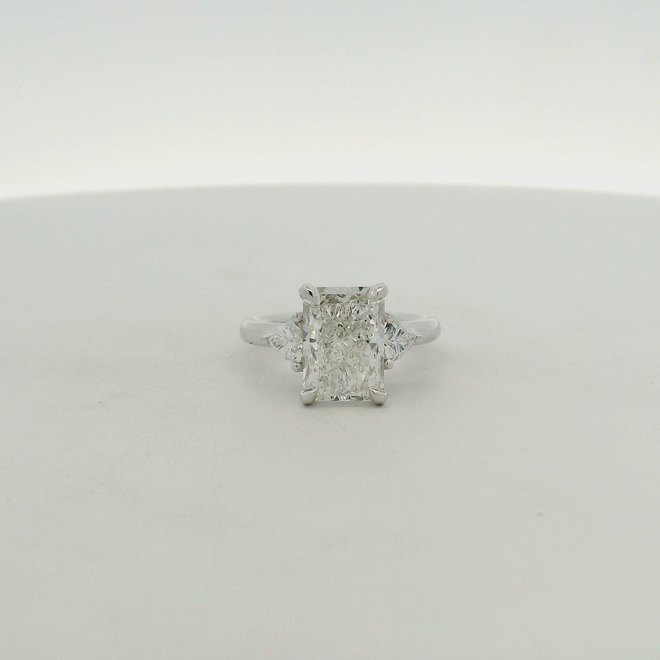Radiant Cut Three-Stone Diamond Ring in White Gold