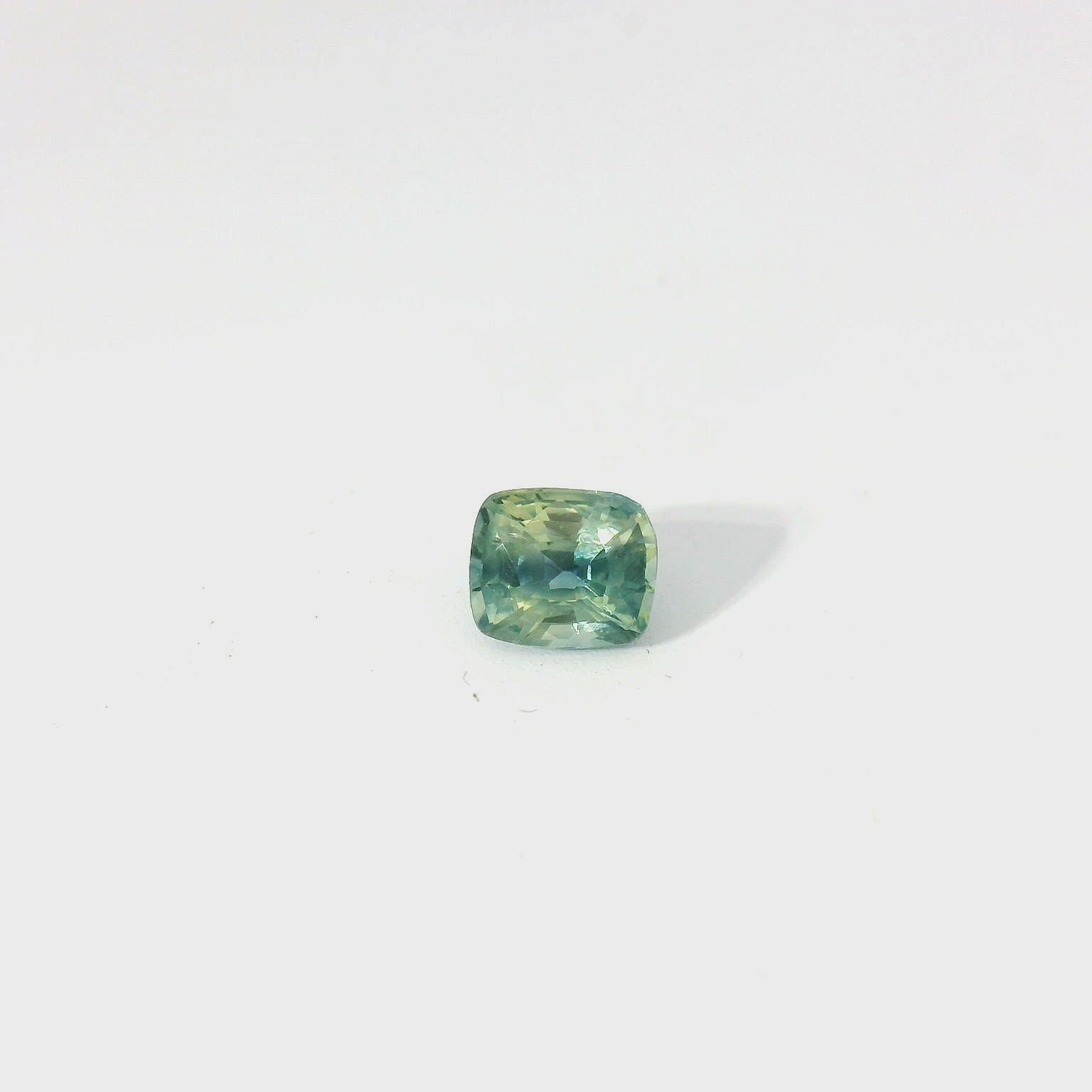 Green cushion sapphire