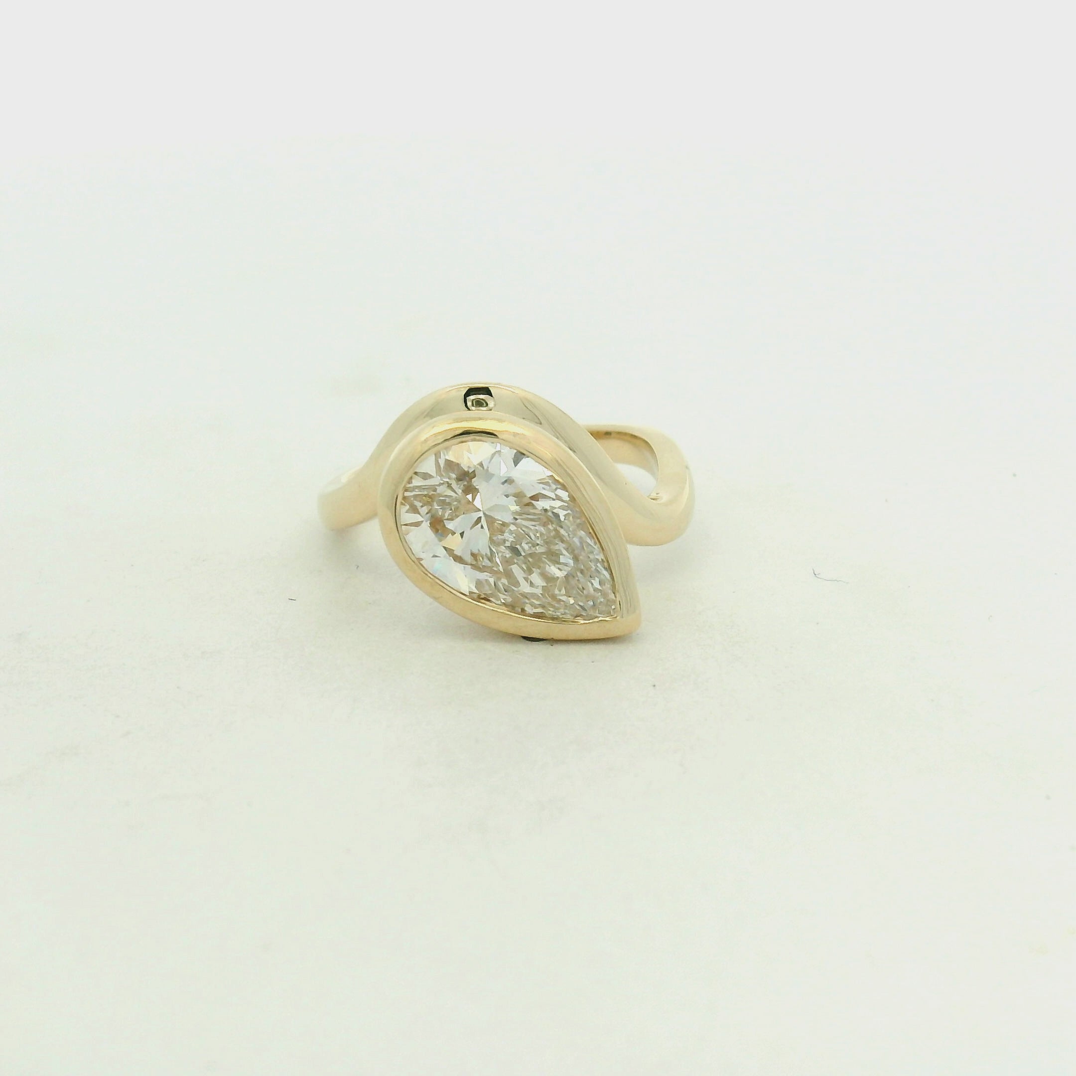 Pear-Shaped Diamond Bezel-Set Solitaire Ring in Yellow Gold