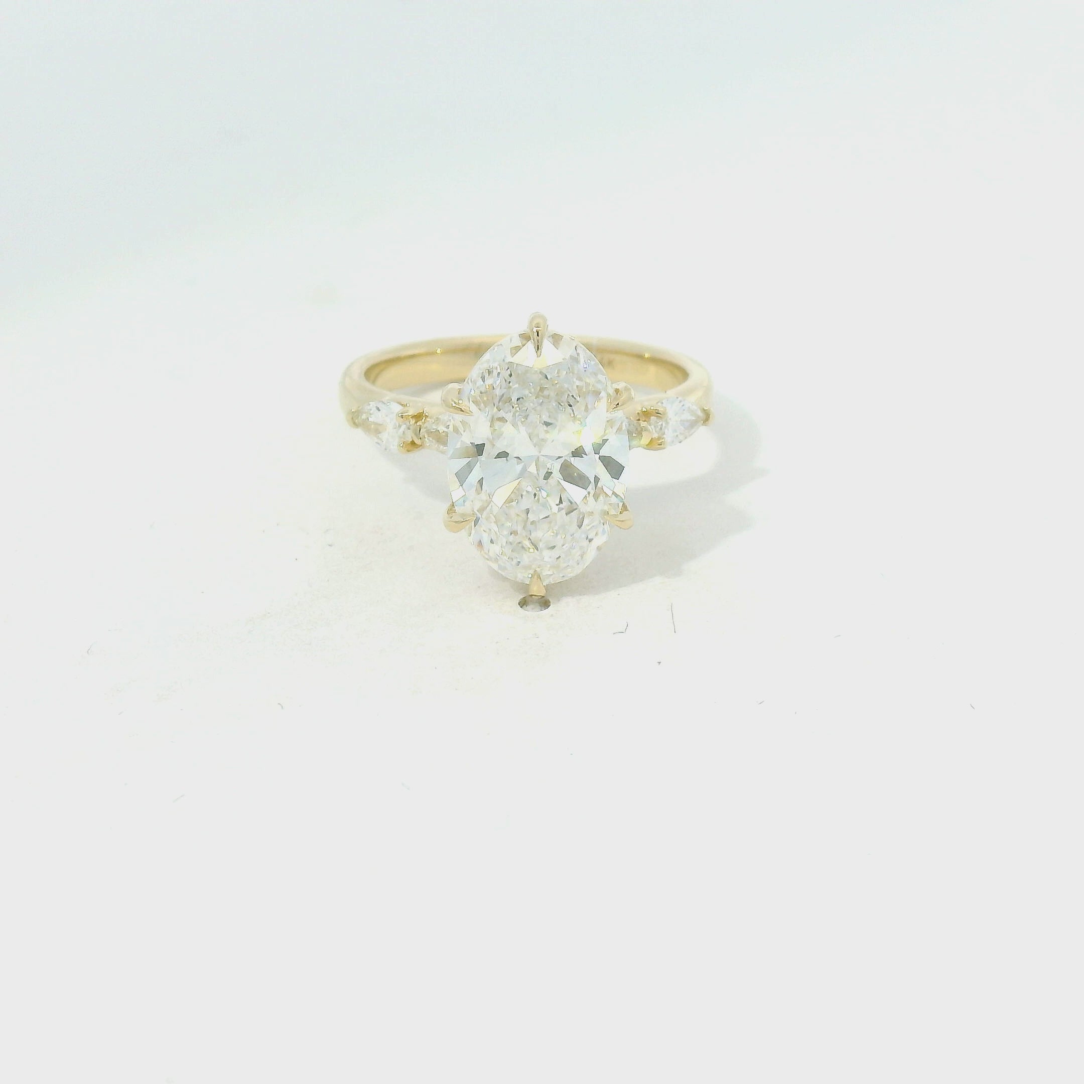 Yellow Gold Oval Diamond Engagement Ring with Side Stones