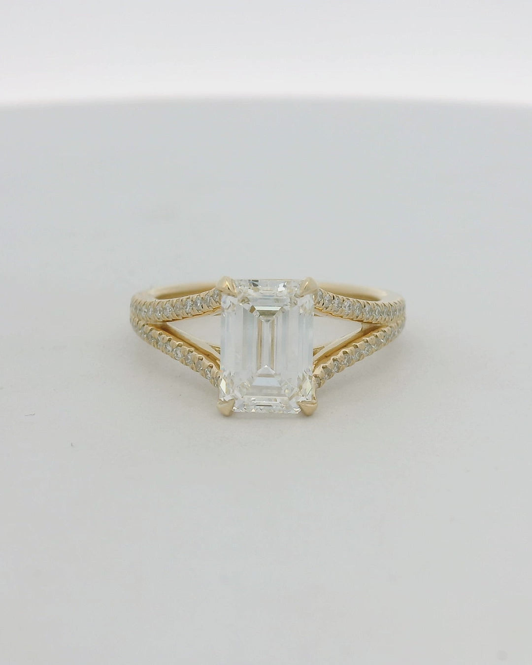 14KT yellow gold split shank Emerald LG Dia Engagement Ring