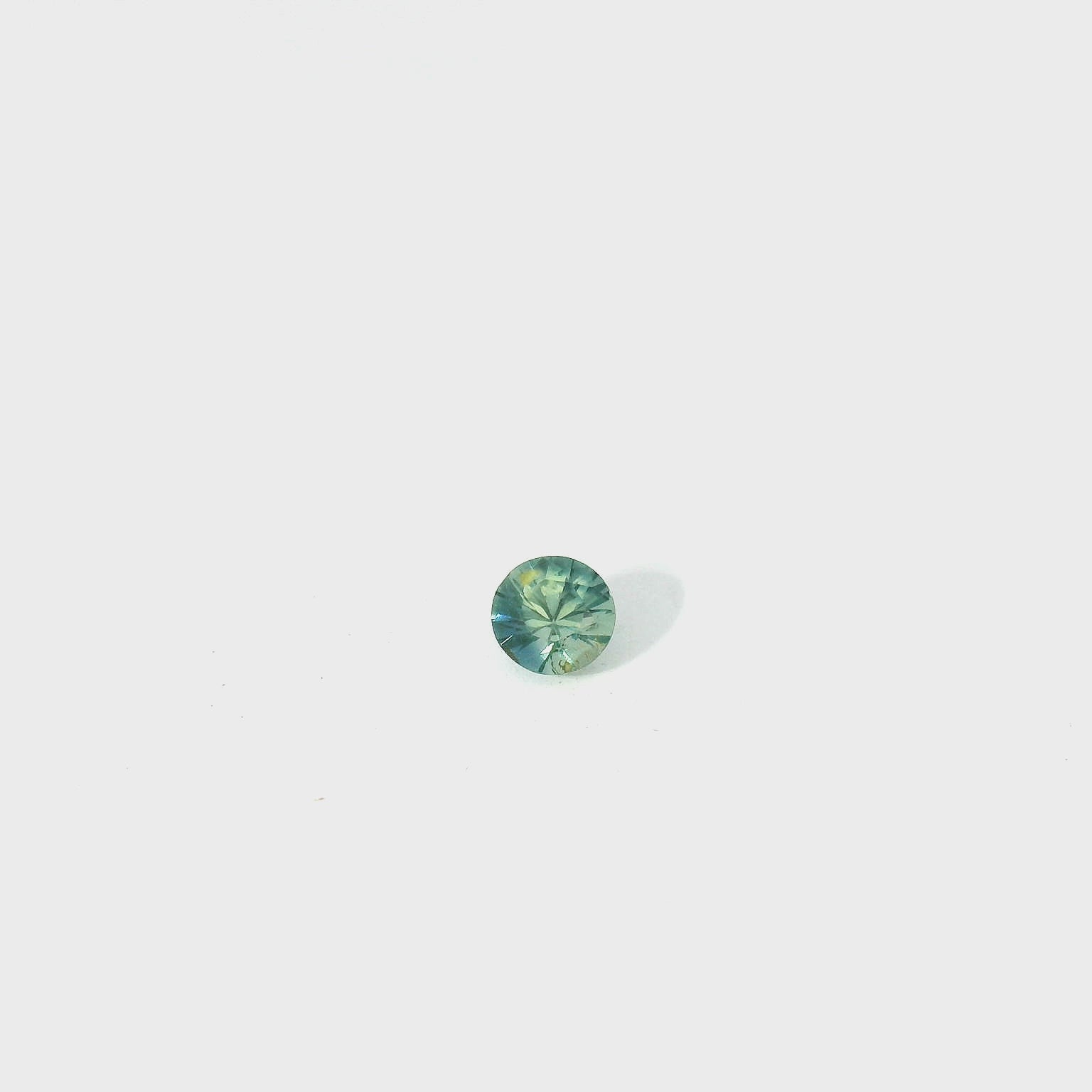 round teal sapphire
