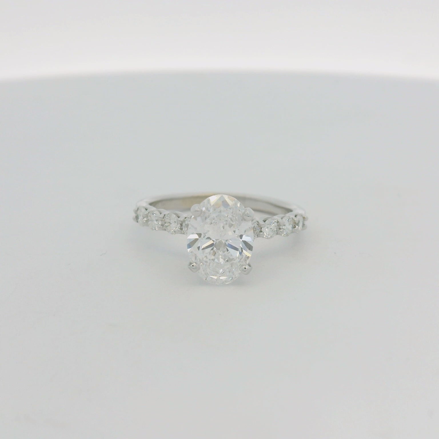 Platinum Multistone Ring with Oval Cut Diamond