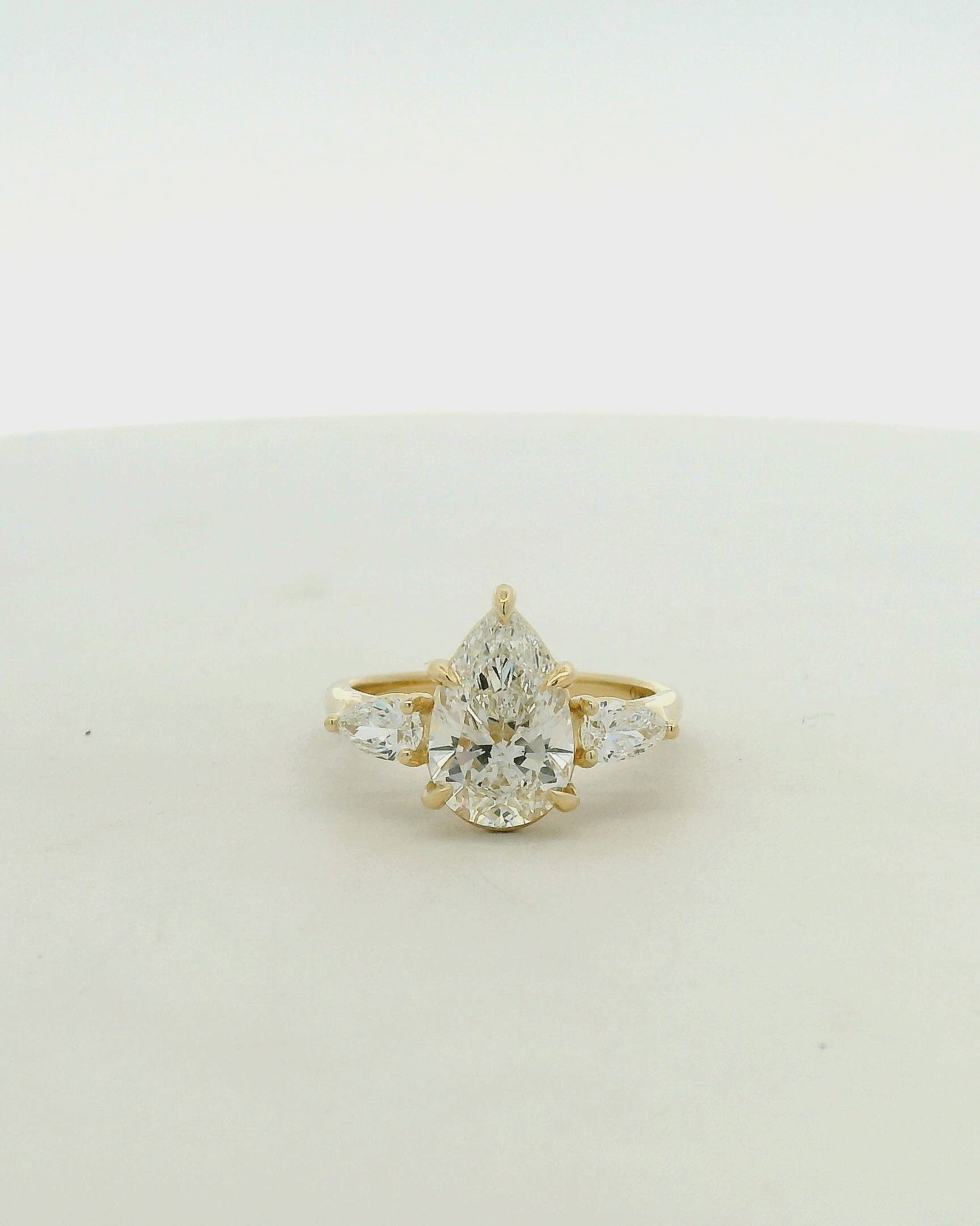 Pear Cut Three-Stone Diamond Engagement Ring in Yellow Gold
