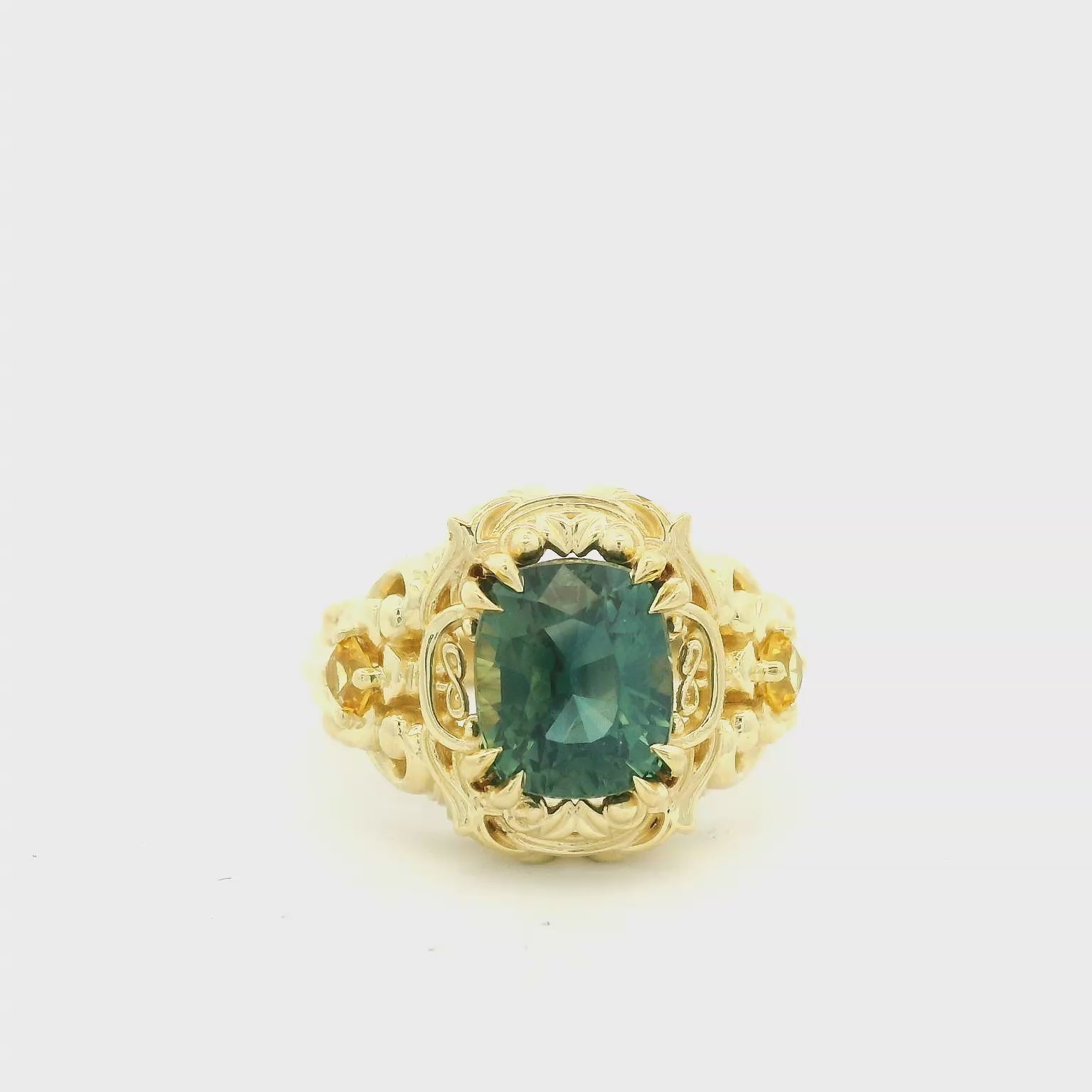 Elegant Gold Ring with Green Gemstone
