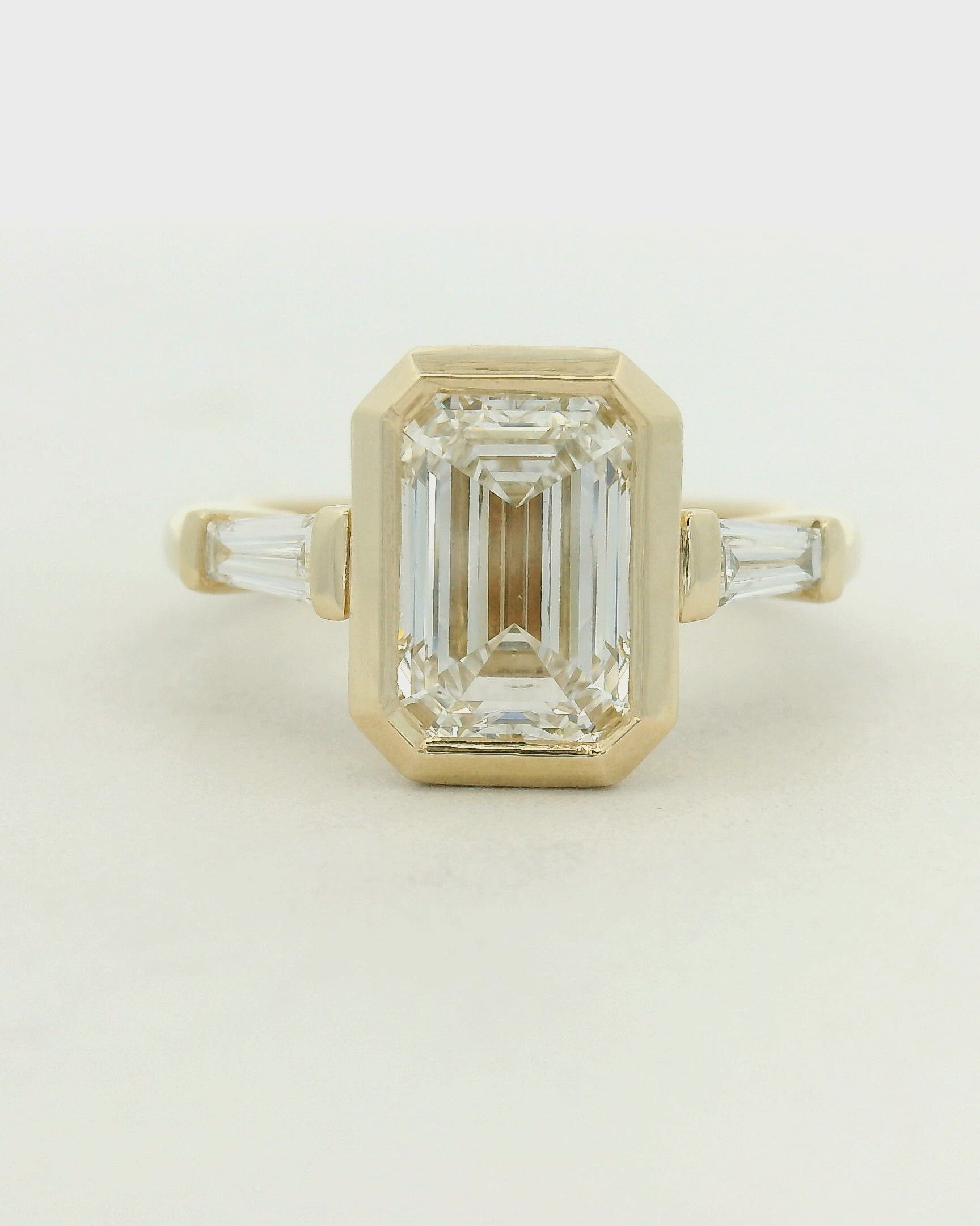 14KYG Bezel Set LG Emerald Cut 3 Stone Engagement Ring