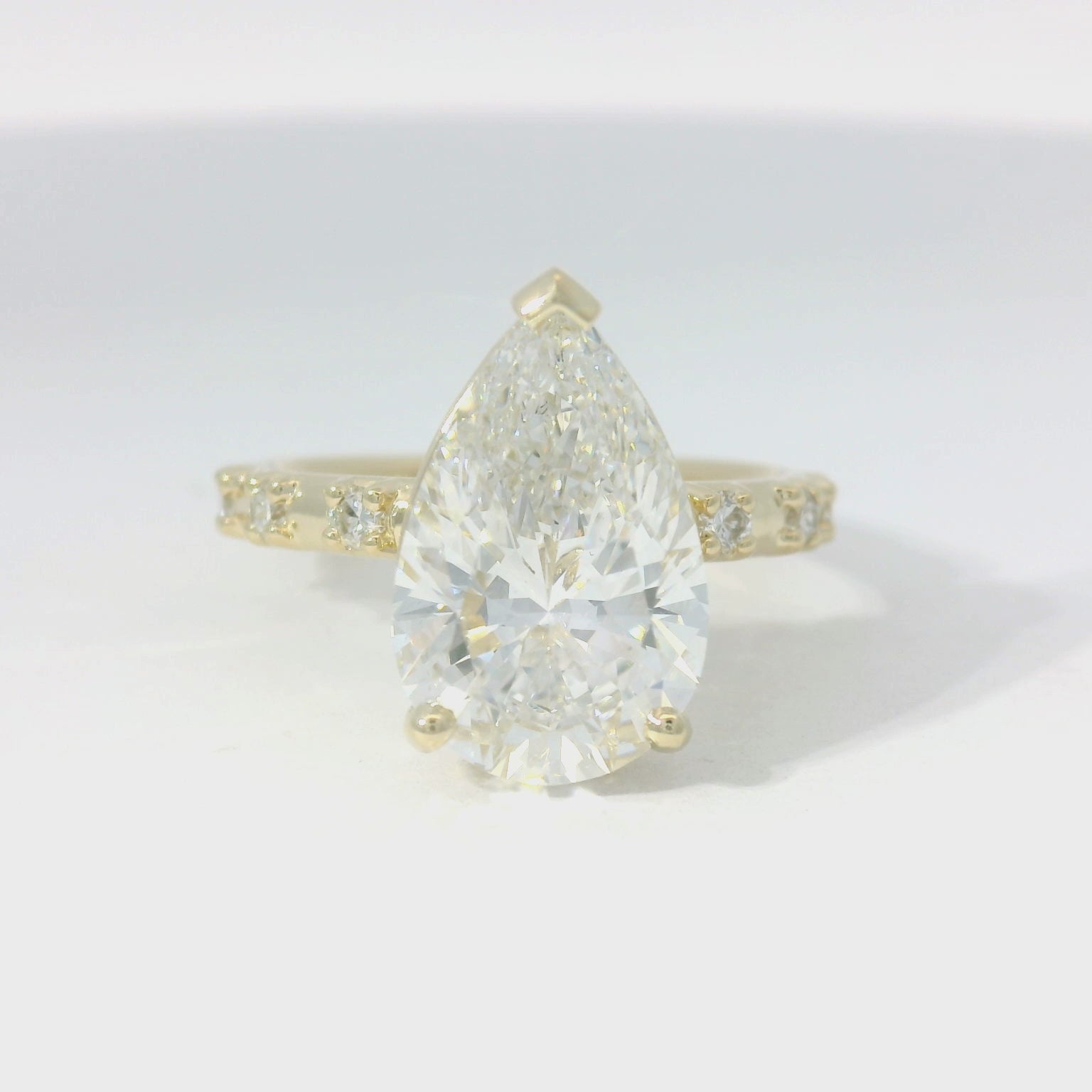 Yellow Gold Multistone Ring with Pear Cut Diamond