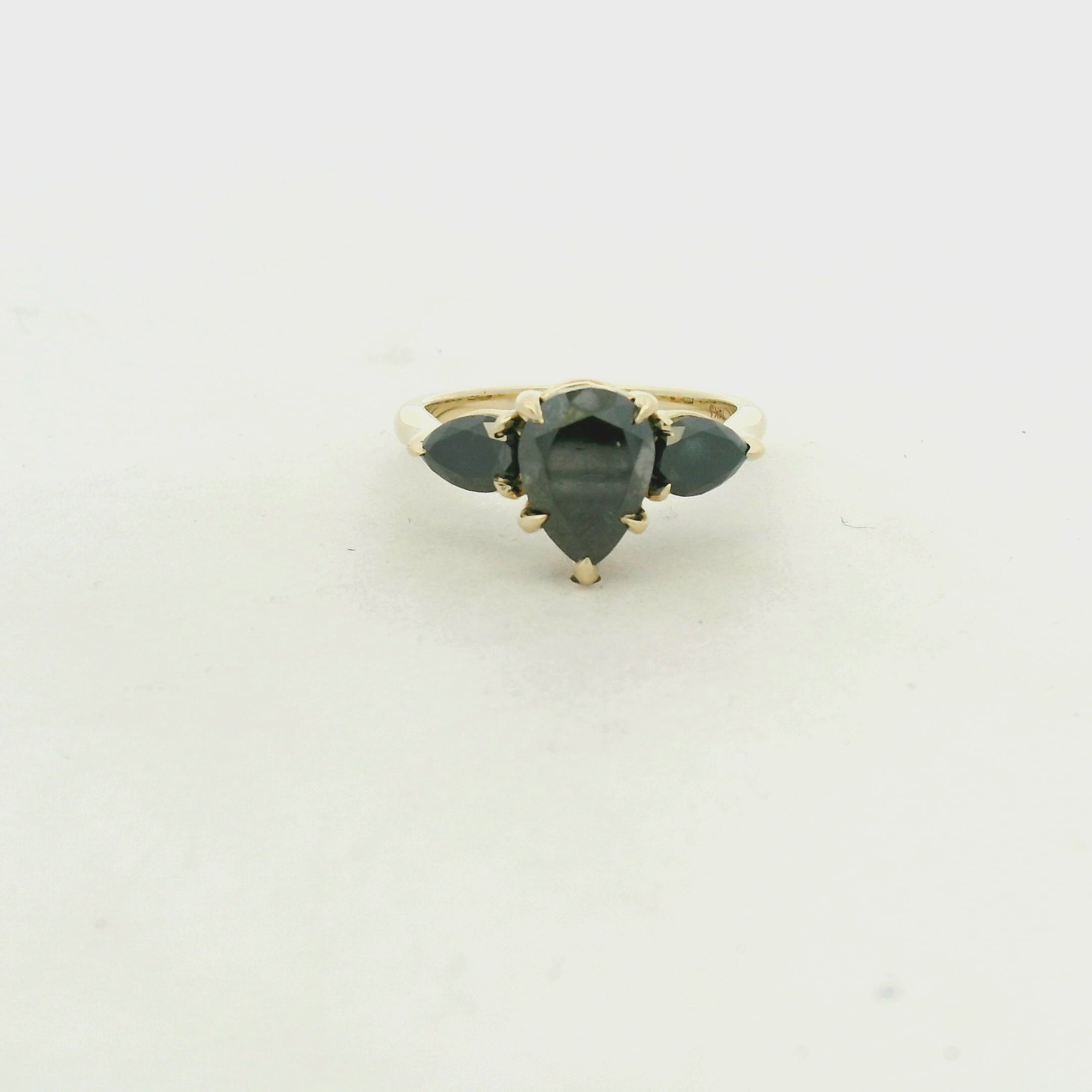Fancy Black Diamond Three-Stone Ring in Yellow Gold