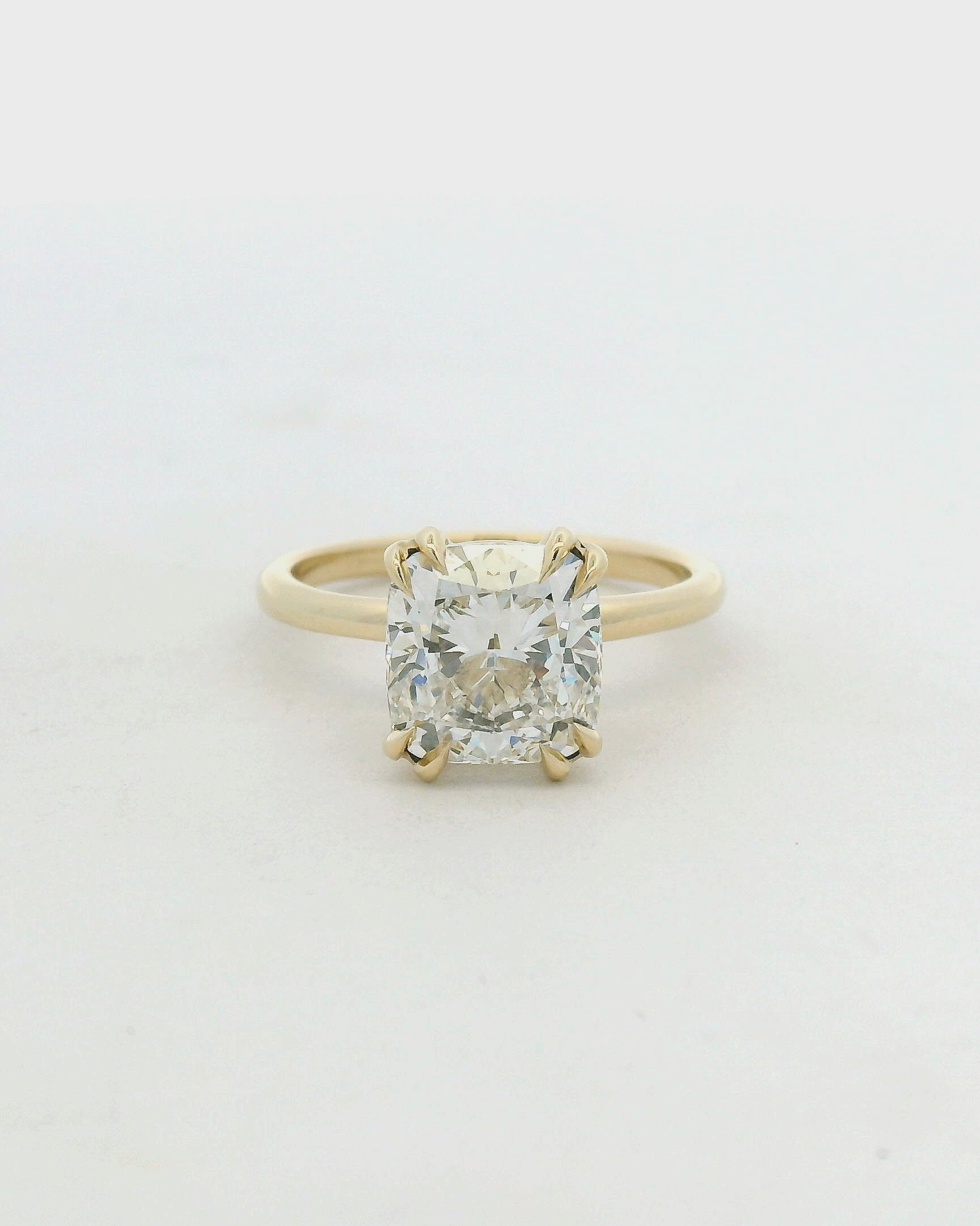 14KT yellow gold double claw prong solitaire cushion engagement ring