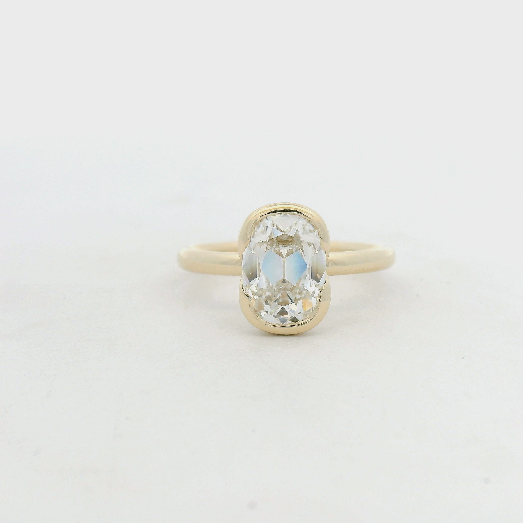 Elongated Diamond Bezel Solitaire Ring in Yellow Gold
