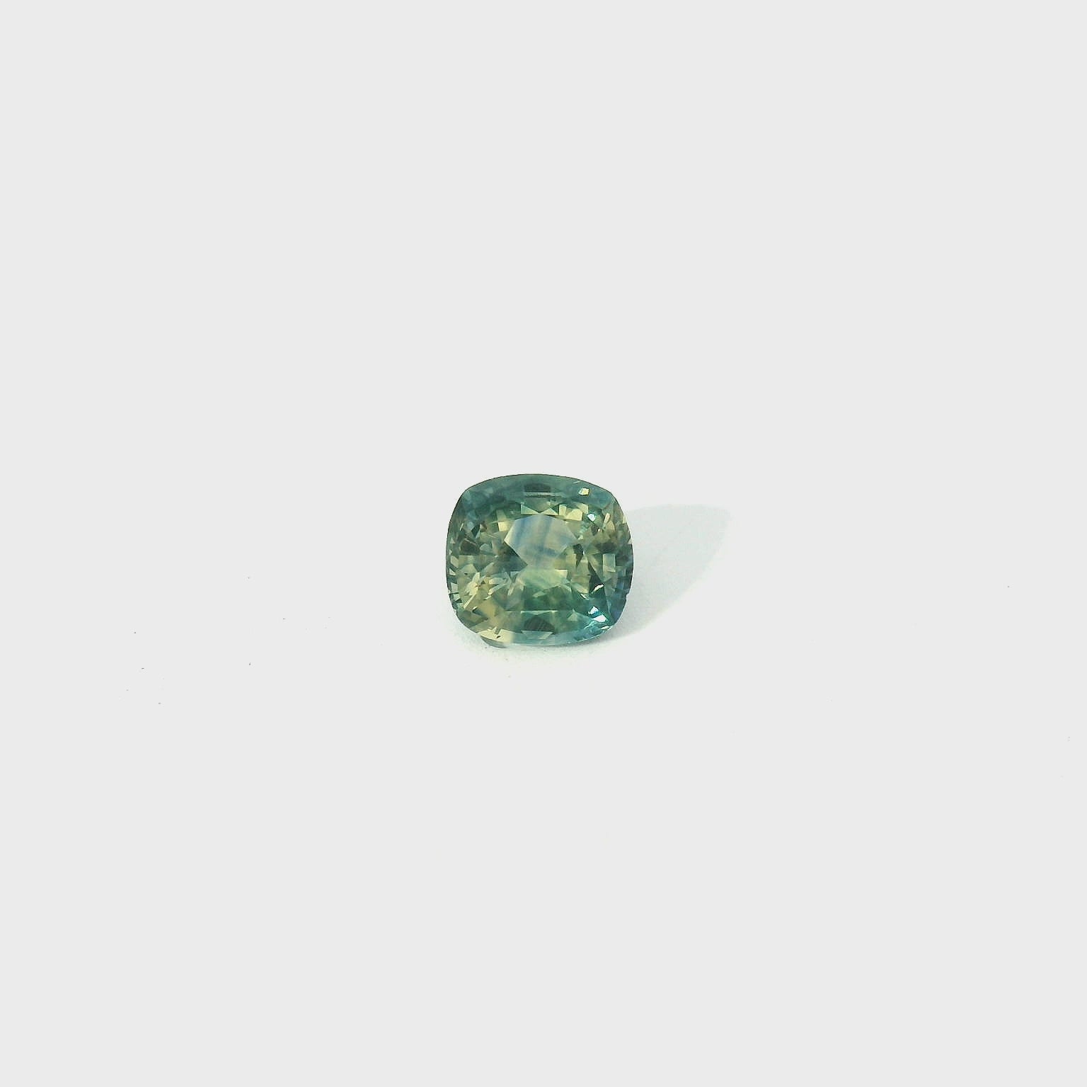 green cushion cut sapphire